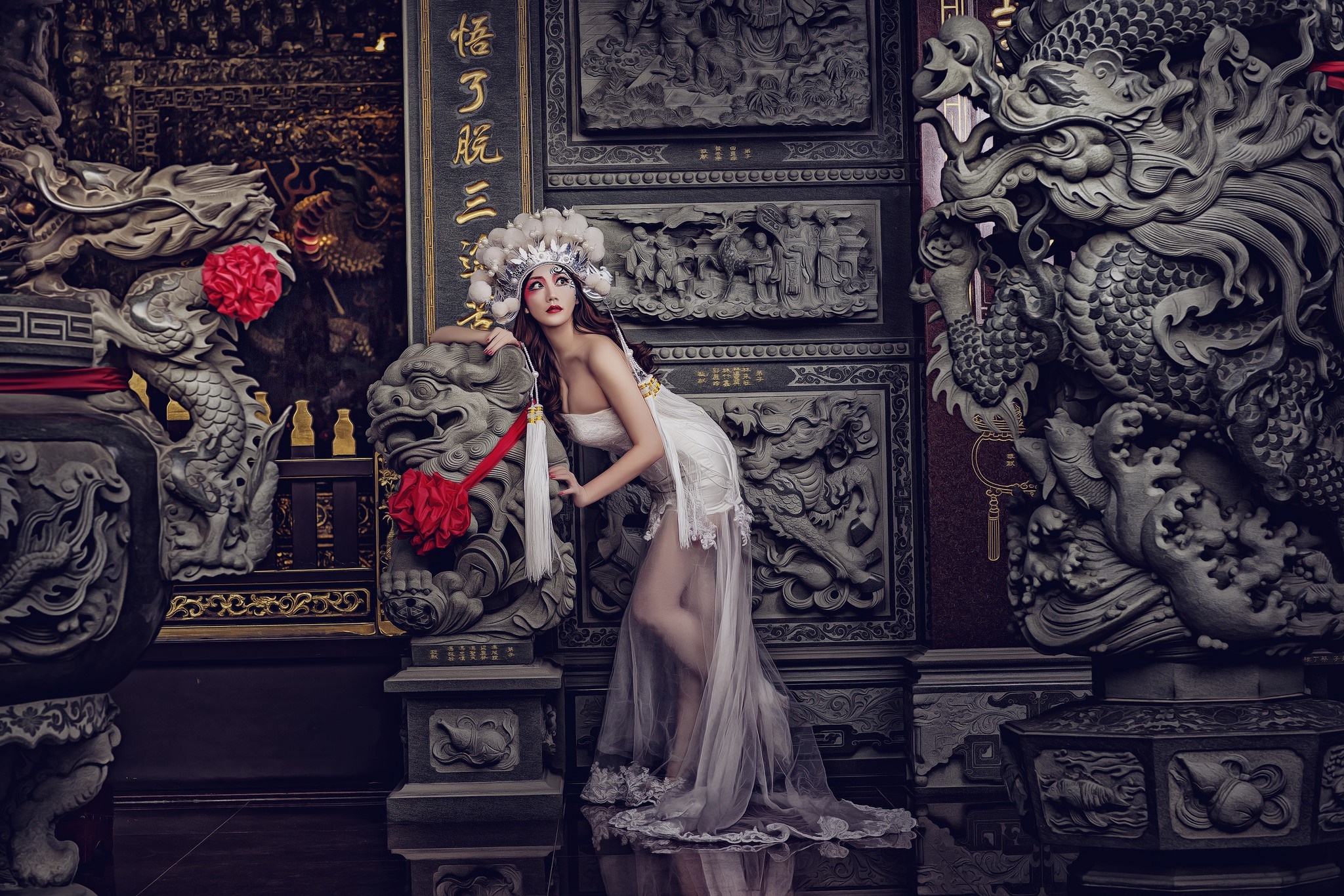 Woman in traditional Asian headdress and dress in temple HD Wallpaper