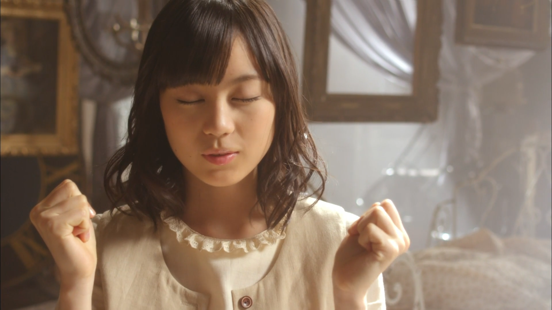 Asian woman with closed eyes and clenched fists HD Wallpaper