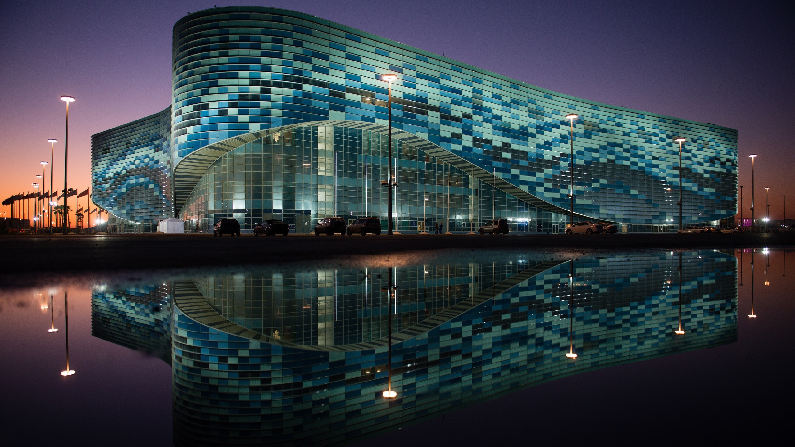 Modern building with blue tiles and reflection at dusk HD Wallpaper