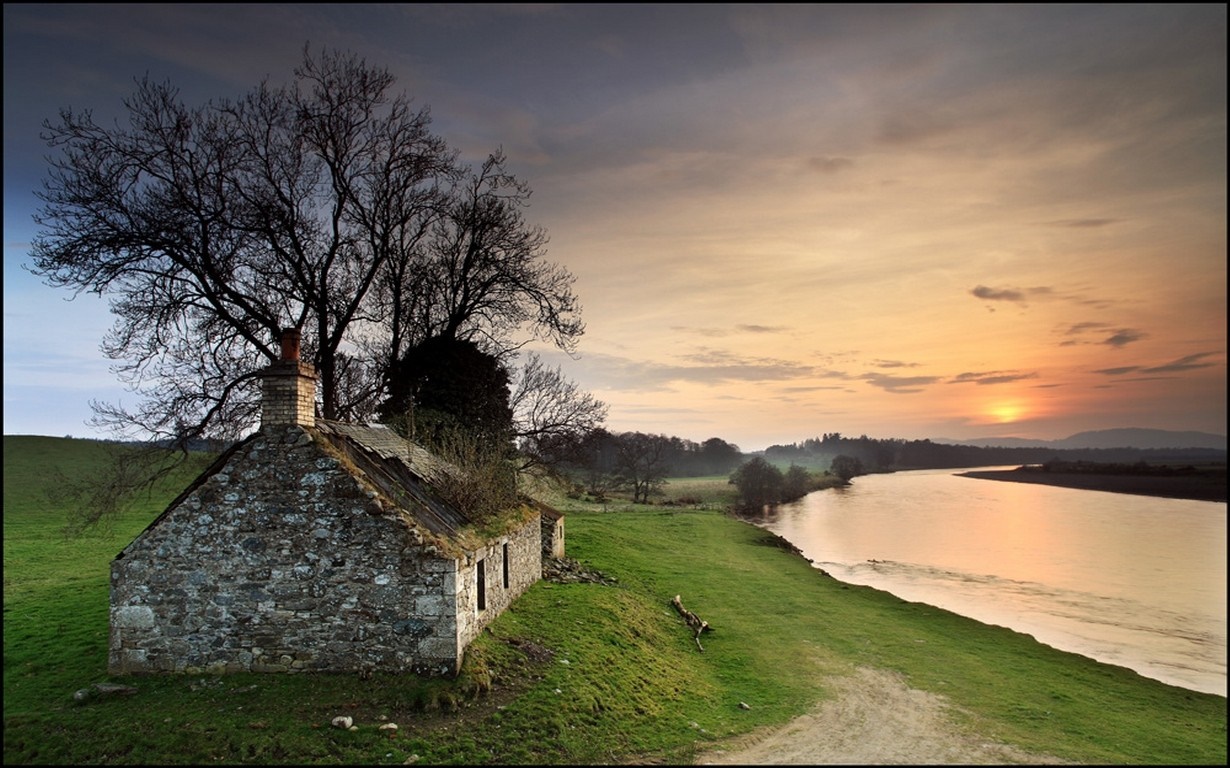 Abandoned stone house by a river at sunset in Scotland HD Wallpaper