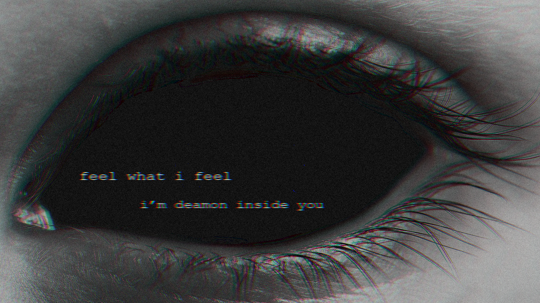 Close-up of a dark eye with text overlay HD Wallpaper