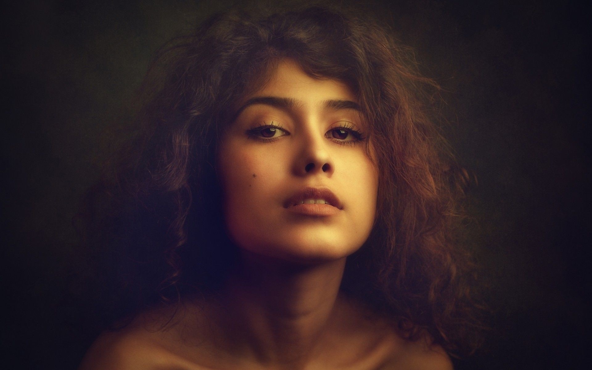 Portrait of a young woman with curly brown hair HD Wallpaper