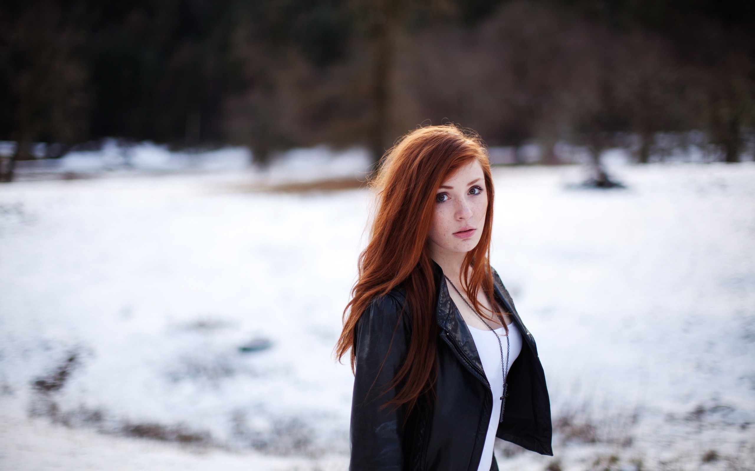Redhead woman in leather jacket in snowy landscape HD Wallpaper