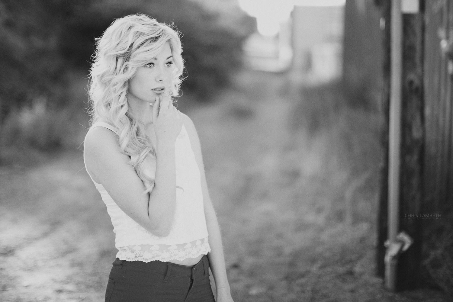 Monochrome portrait of a woman with blonde curly hair HD Wallpaper