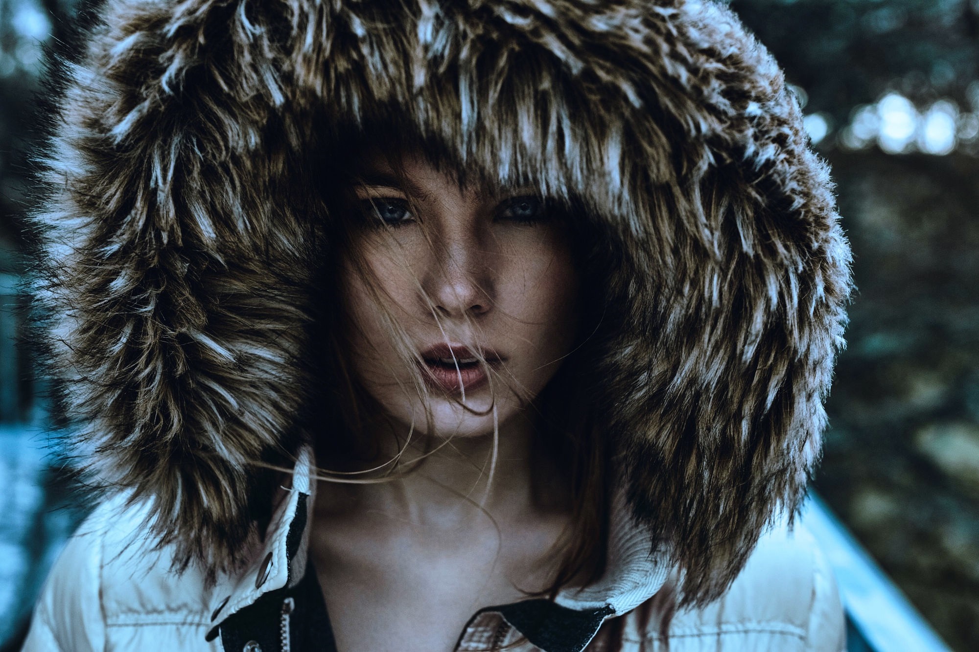 Woman with fur hood looking at viewer HD Wallpaper