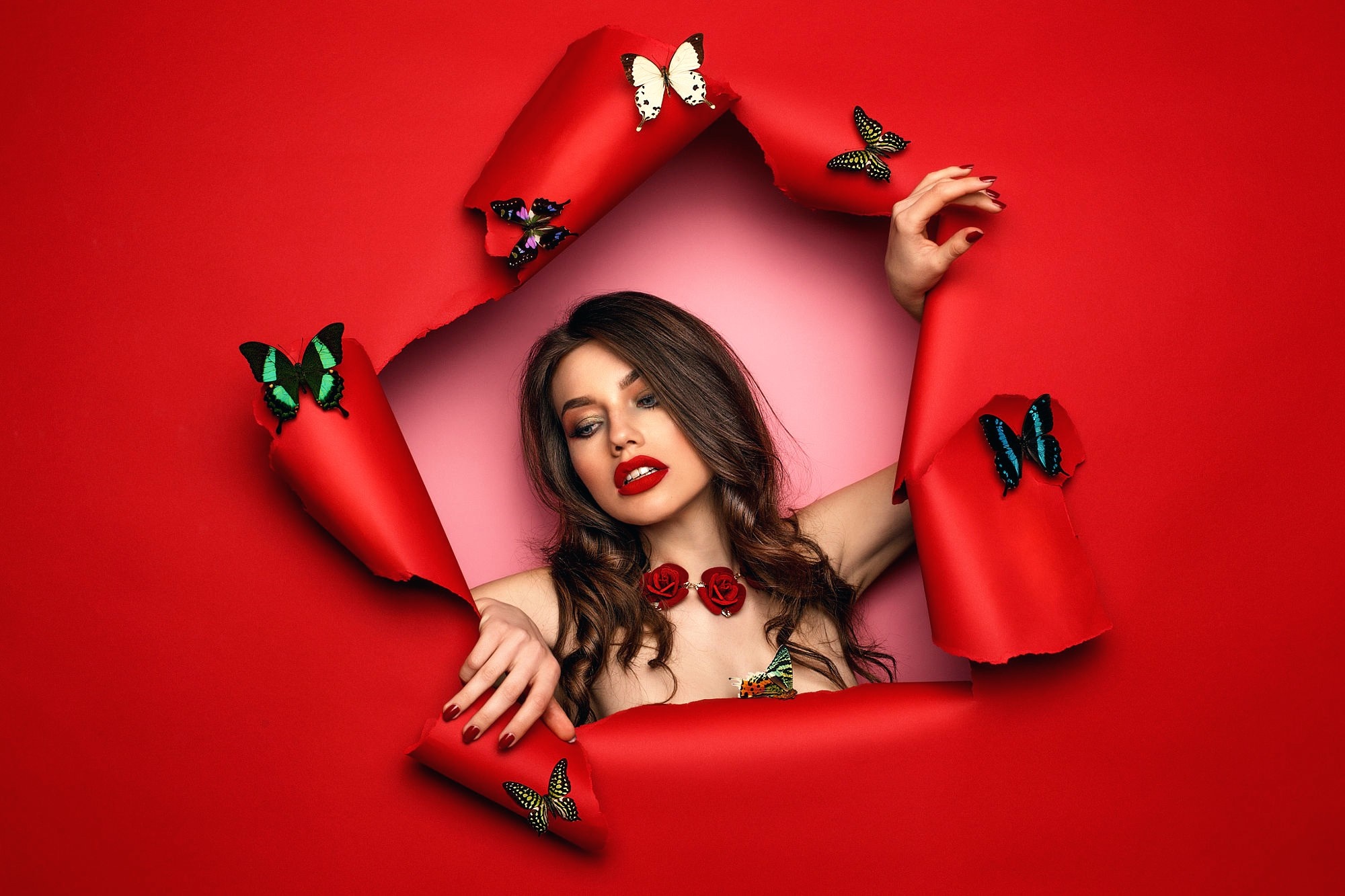 Woman with butterflies emerging from red paper HD Wallpaper