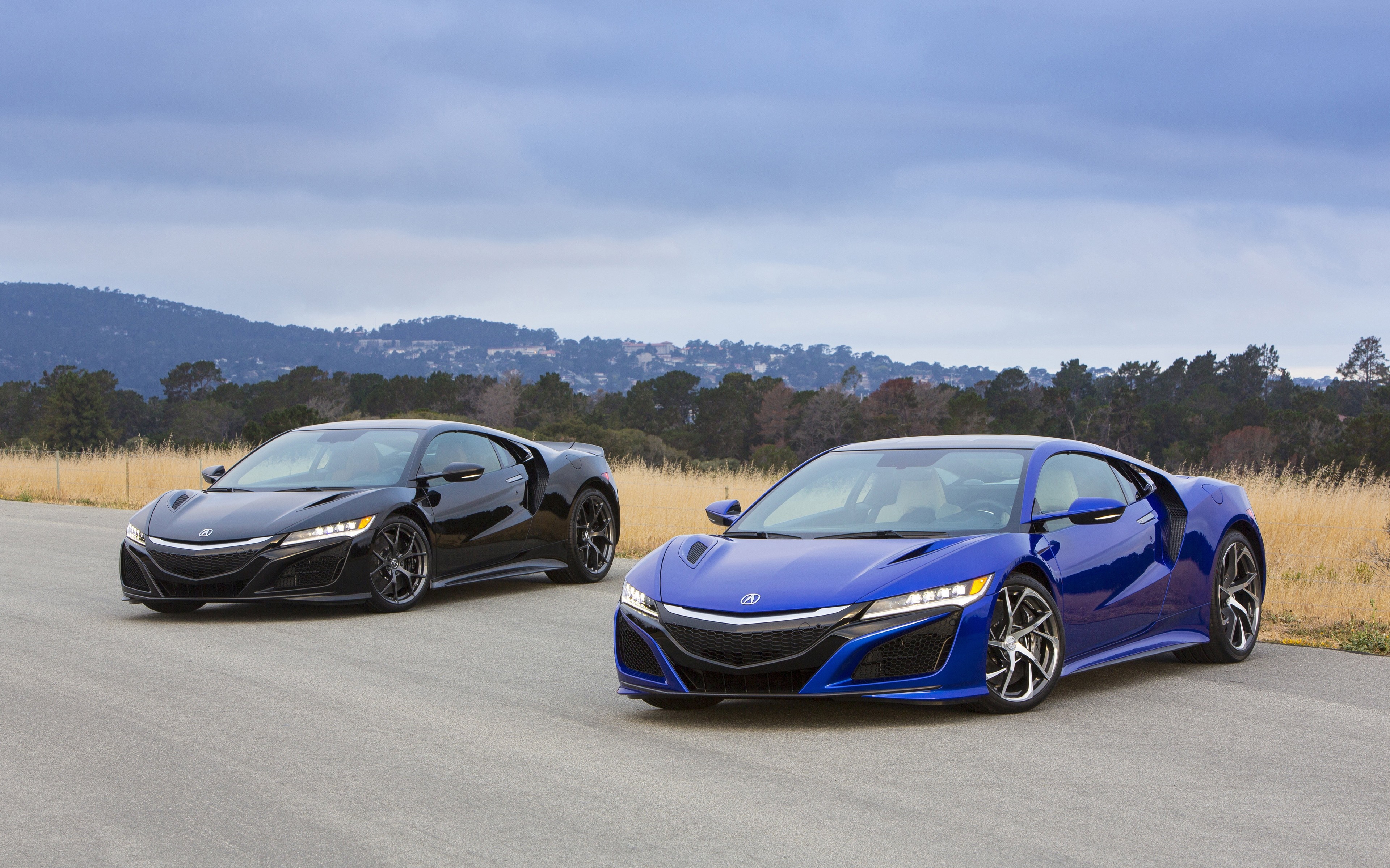 Two Acura NSX sports cars on a road HD Wallpaper