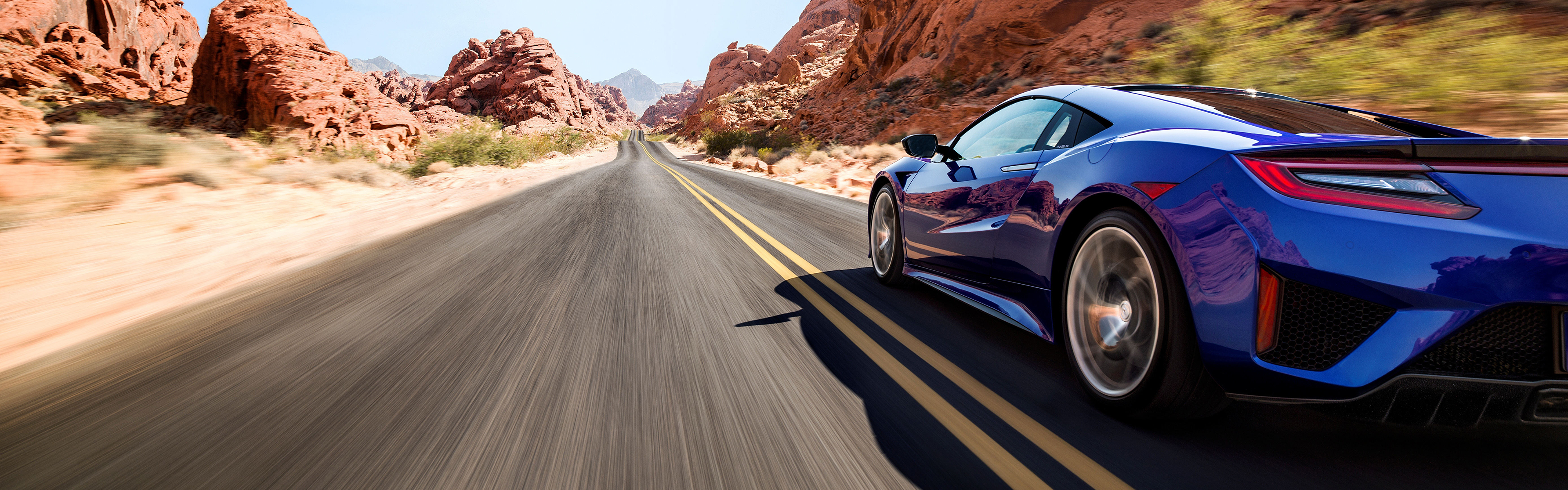 Blue Acura NSX driving on a desert road HD Wallpaper