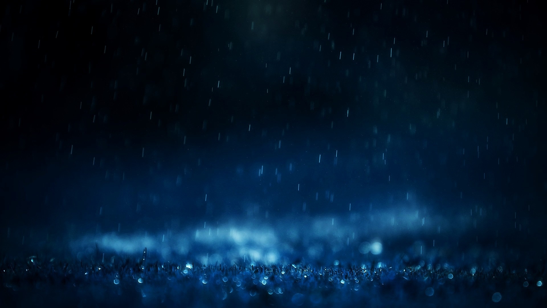 Rain falling at night with bokeh lights HD Wallpaper