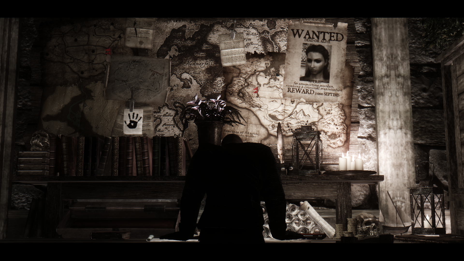 Wanted poster and maps in a dark room HD Wallpaper