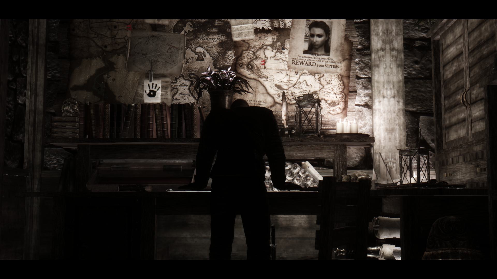 Man in suit in dimly lit room with maps and posters HD Wallpaper