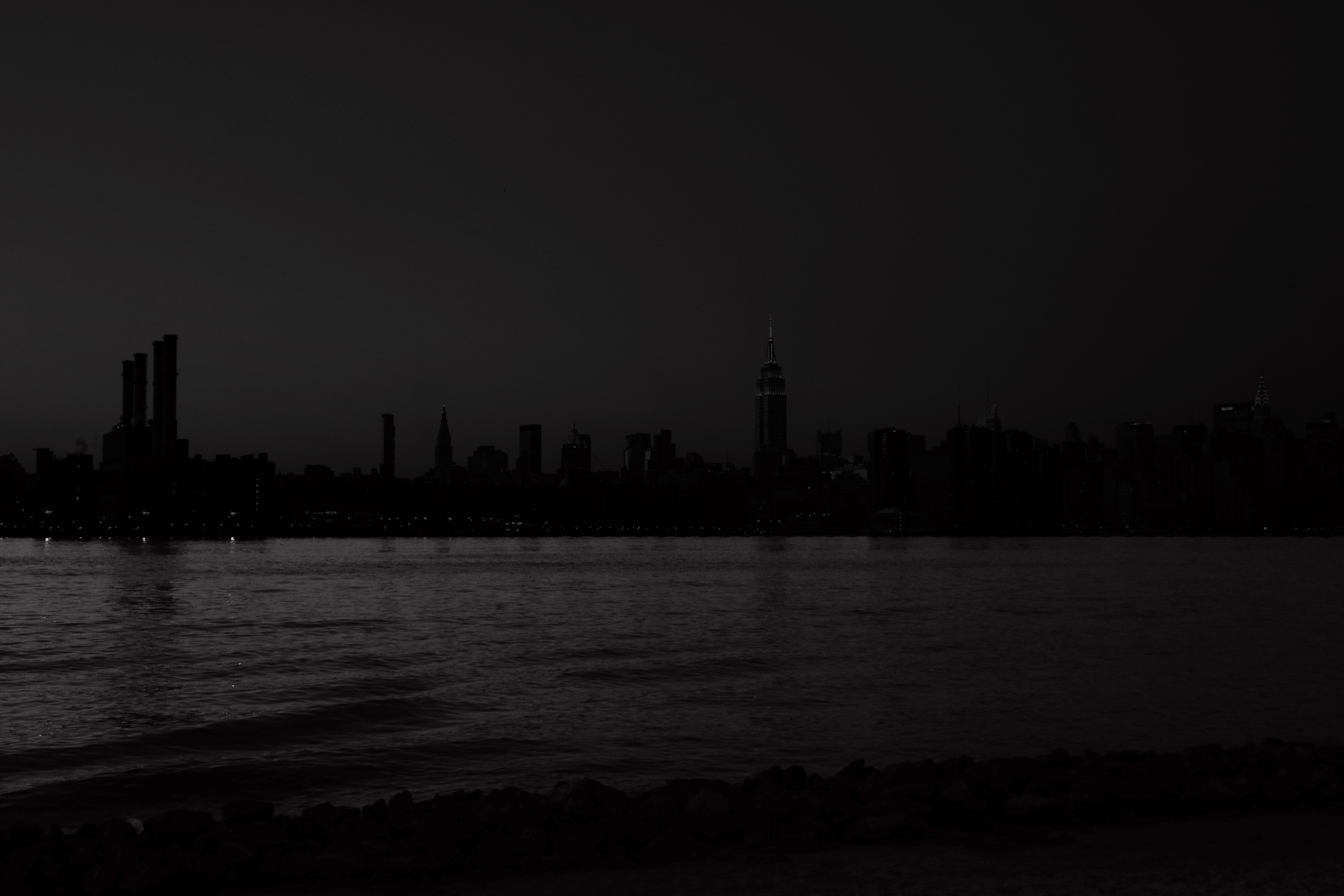 New York City skyline at night over water HD Wallpaper
