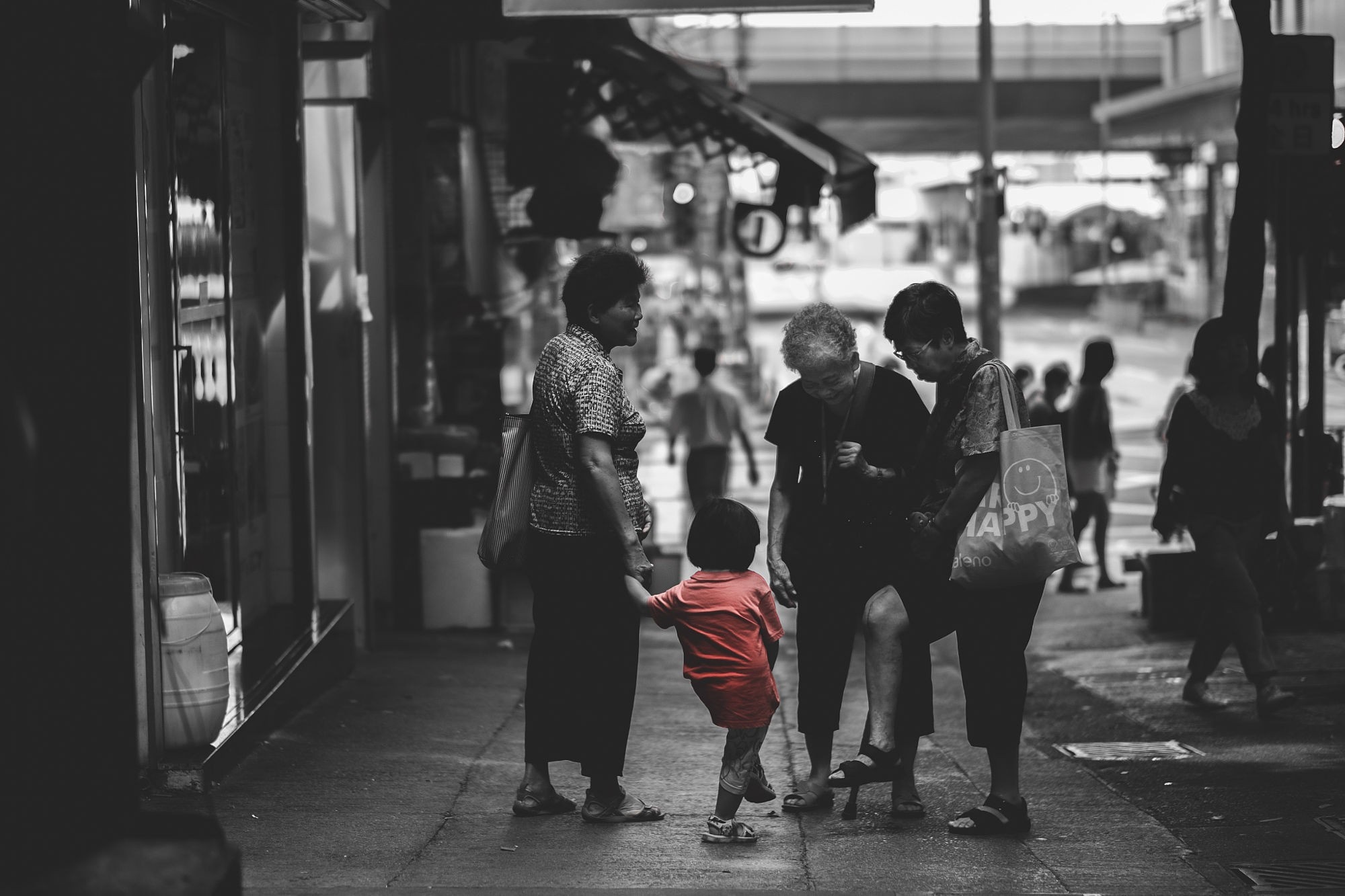 Selective coloring of elderly women and child on street HD Wallpaper