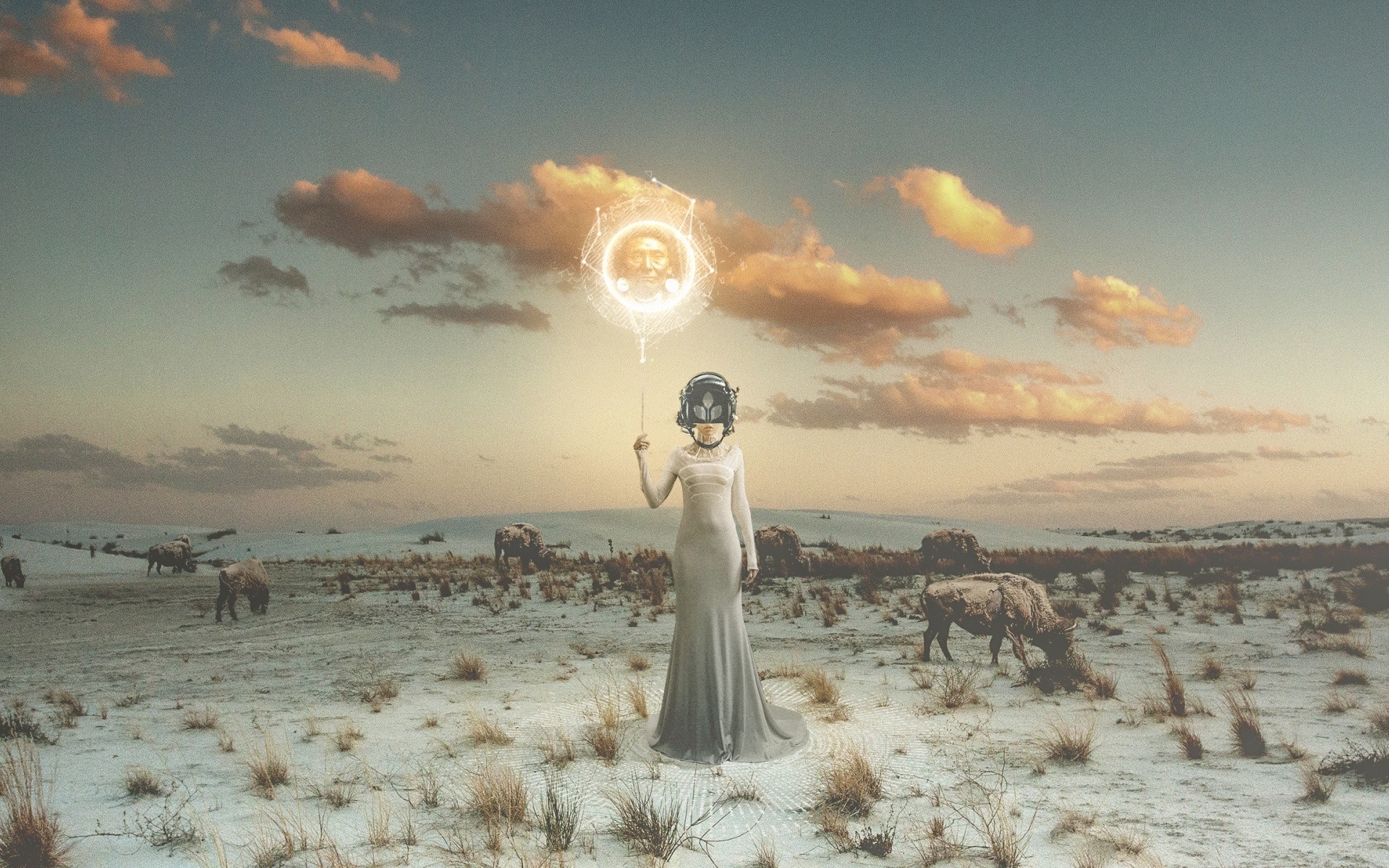 Woman with futuristic helmet holding a glowing orb in a desert landscape HD Wallpaper