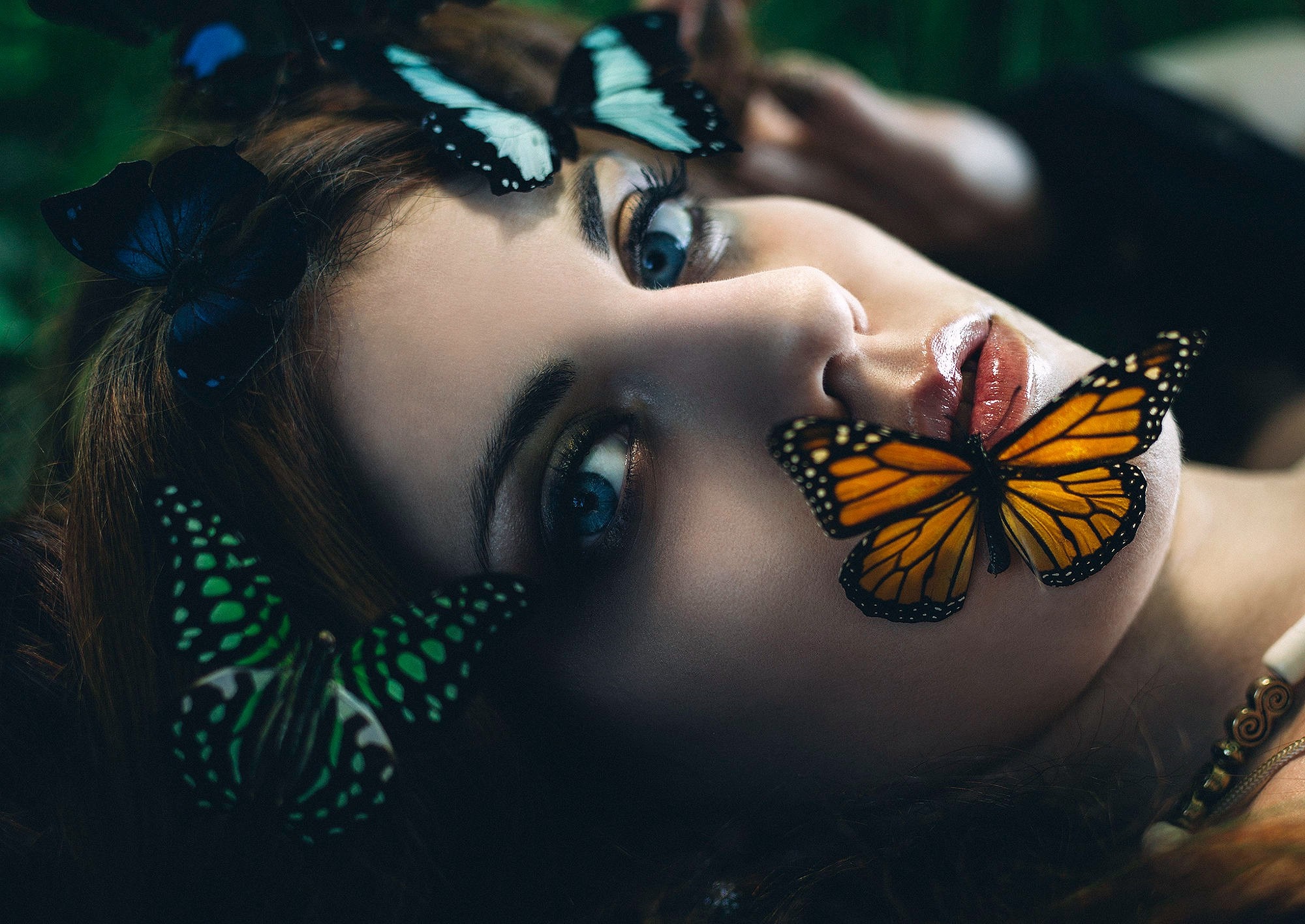 Woman with blue eyes and butterflies on face HD Wallpaper