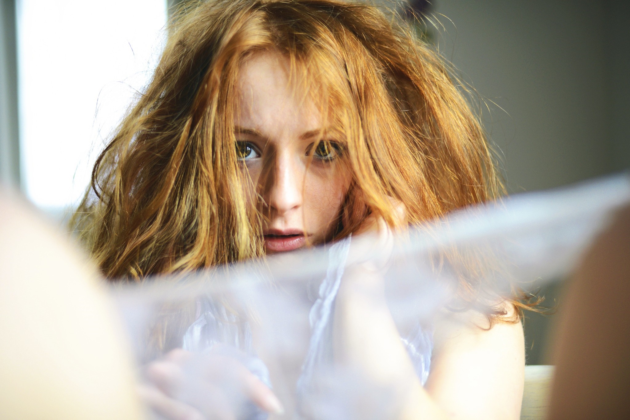 Woman with long red hair looking at the camera HD Wallpaper