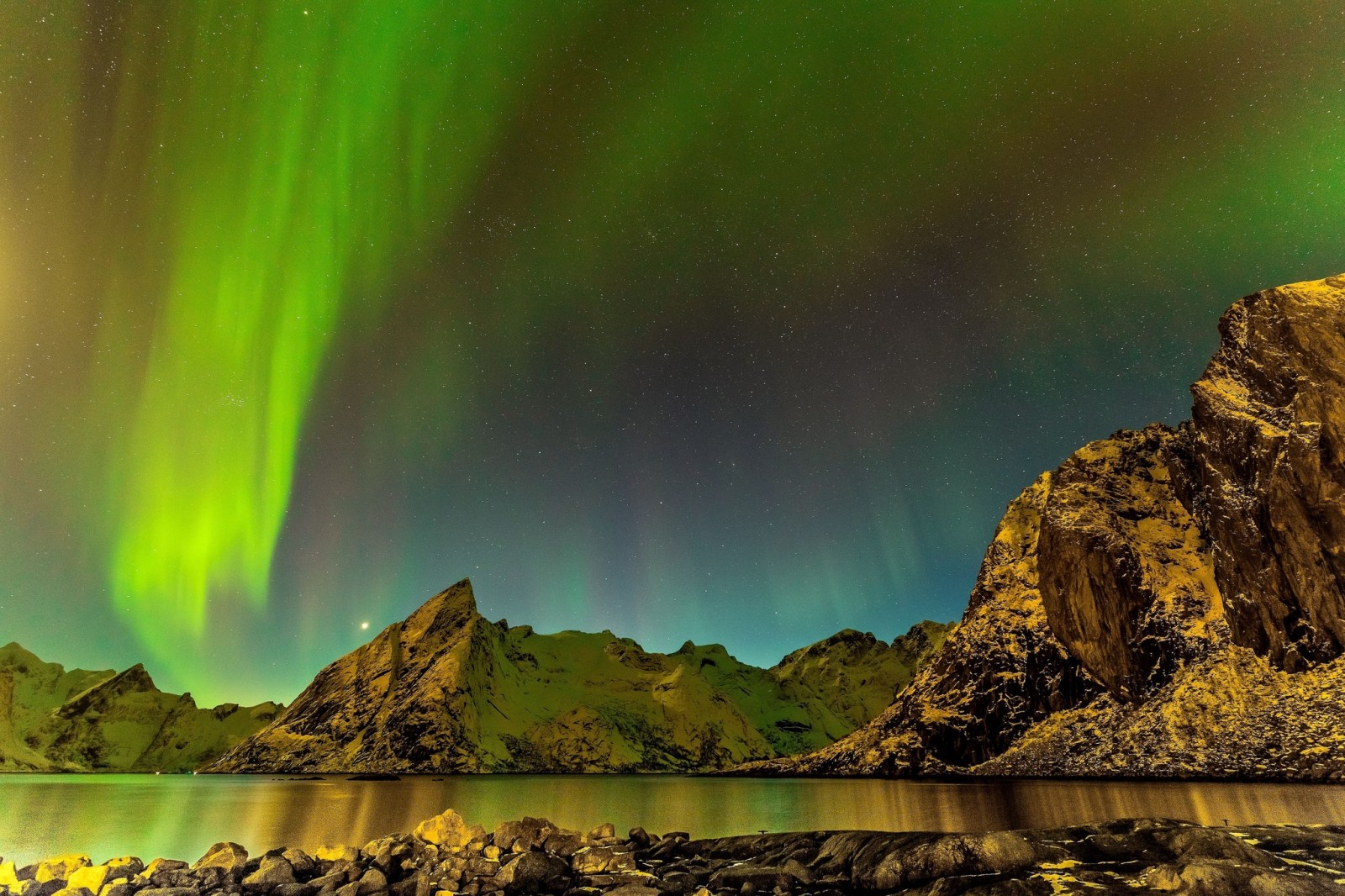 Aurora Borealis over mountains and water HD Wallpaper