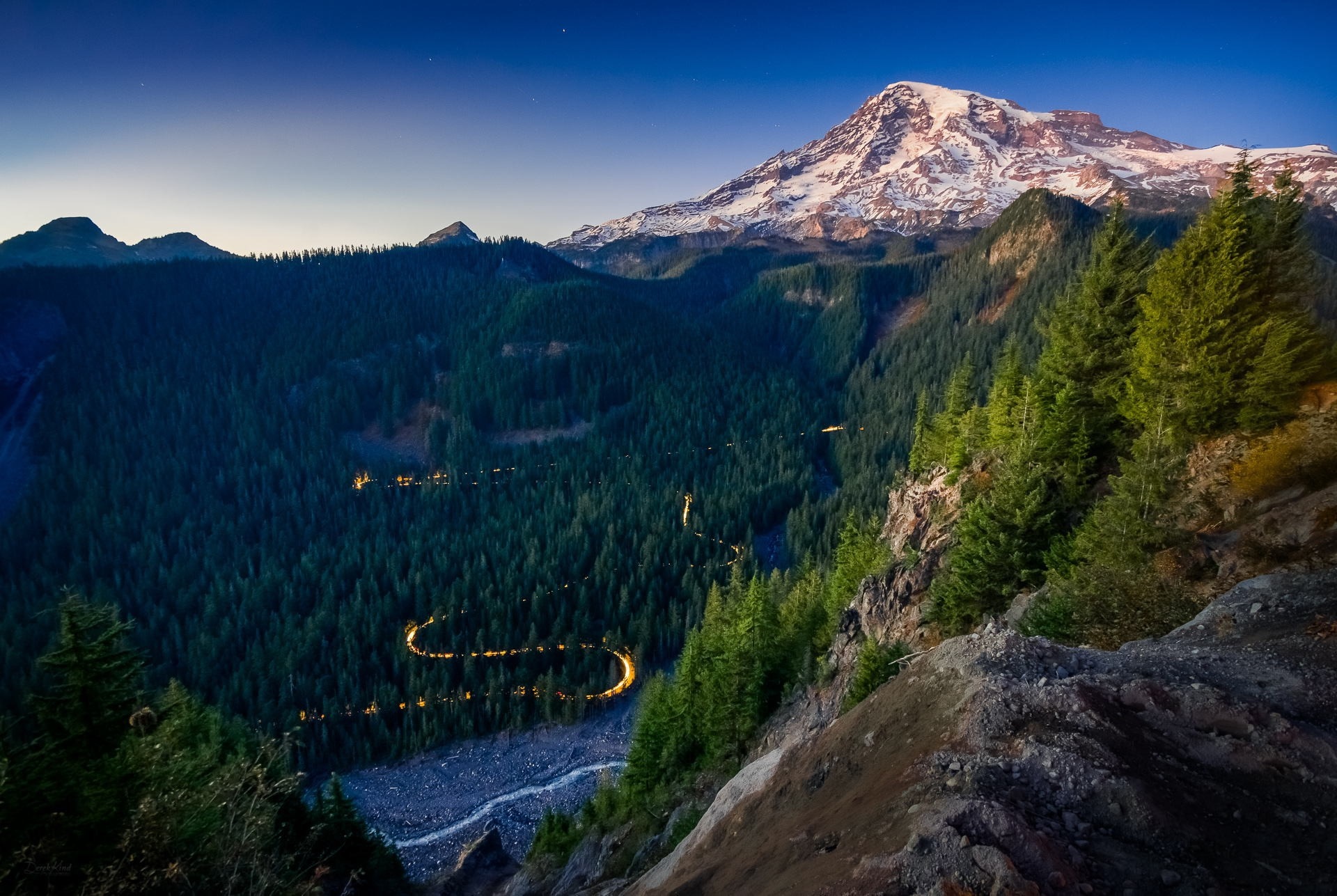 Mount Rainier National Park with winding road at dusk HD Wallpaper
