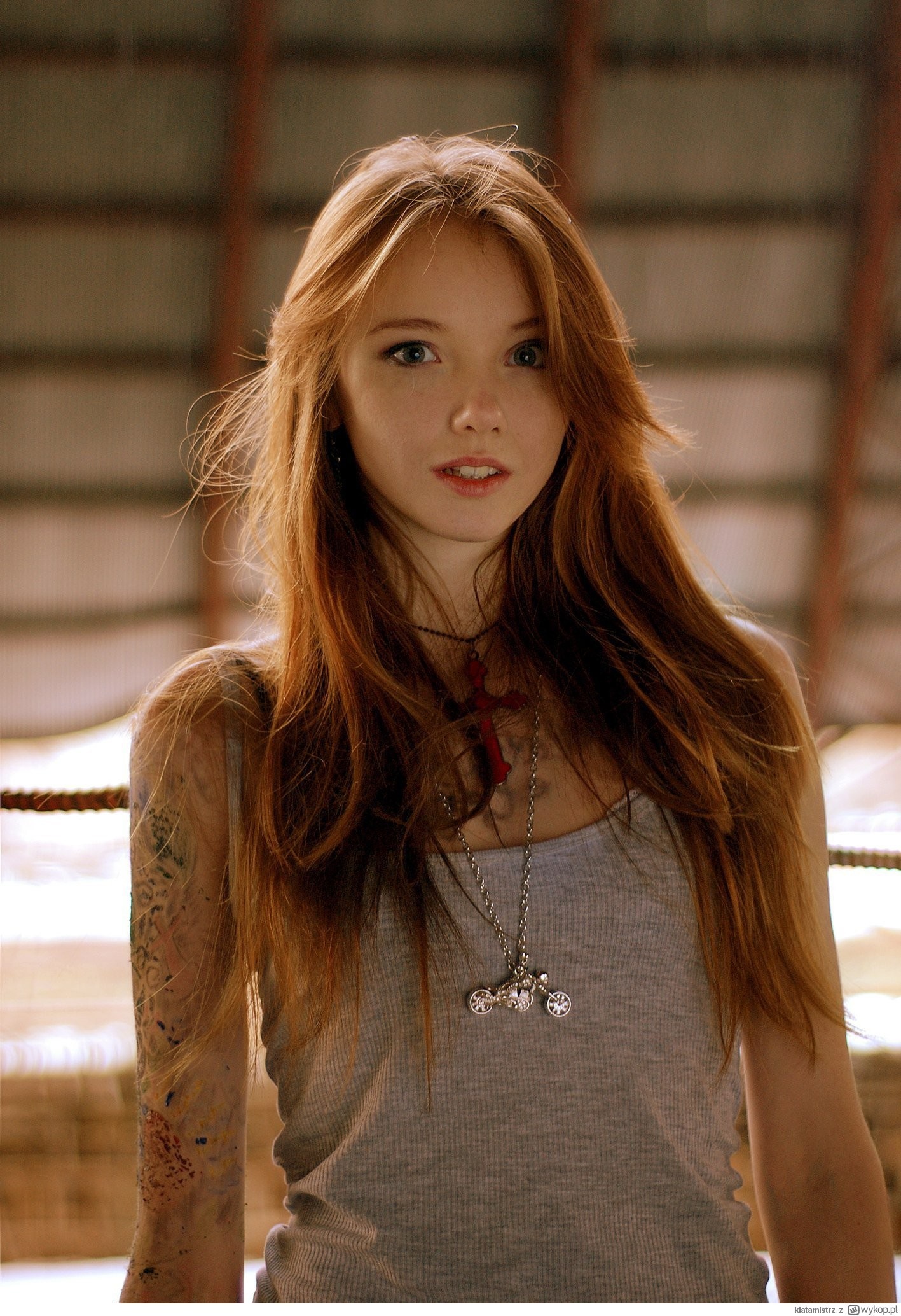 Portrait of a Redhead Woman with Tattoo and Long Hair HD Wallpaper