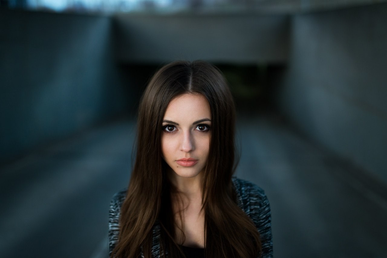Woman with long brown hair in a dark tunnel HD Wallpaper