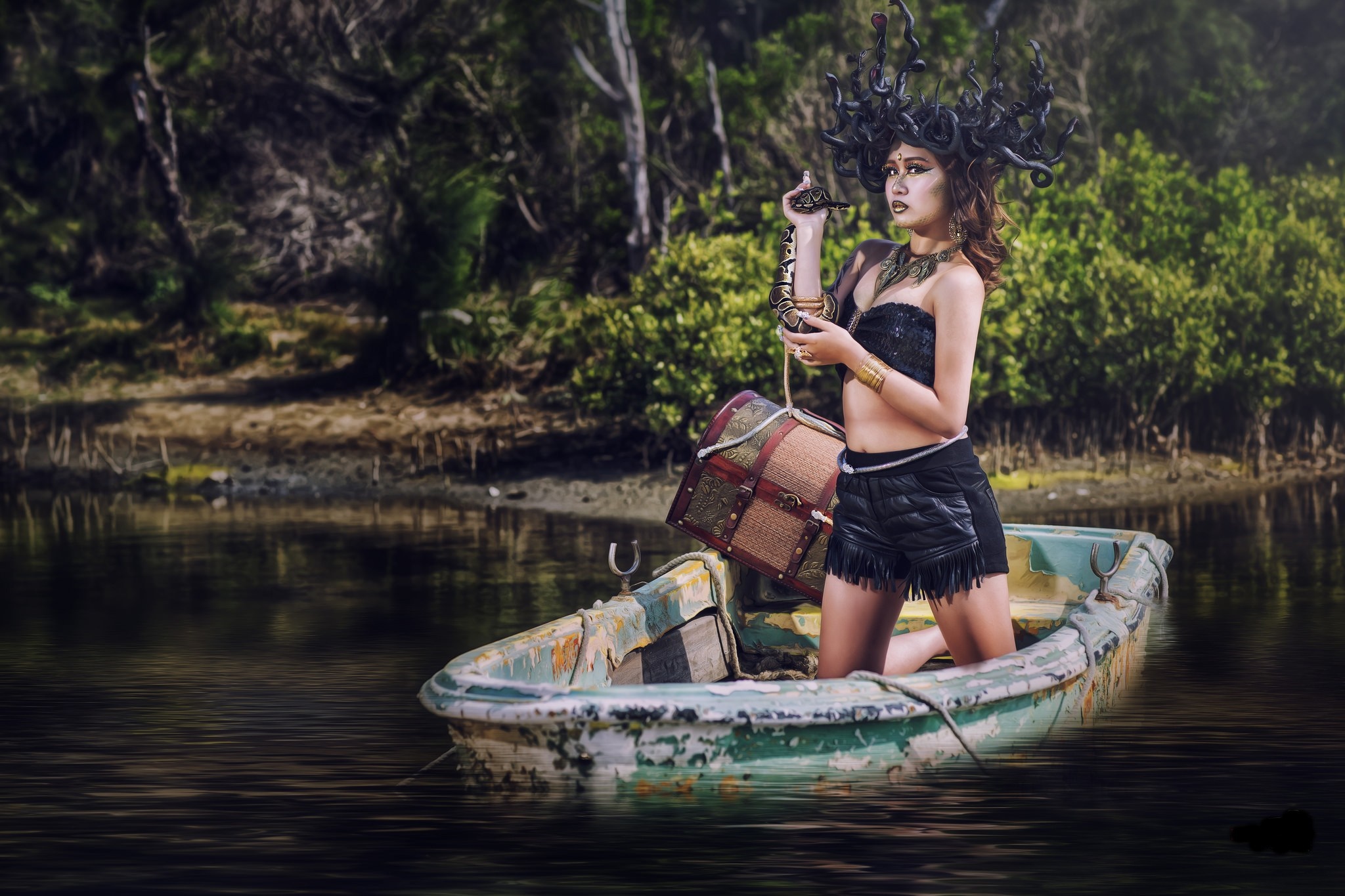 Woman dressed as Medusa with snake in a boat HD Wallpaper