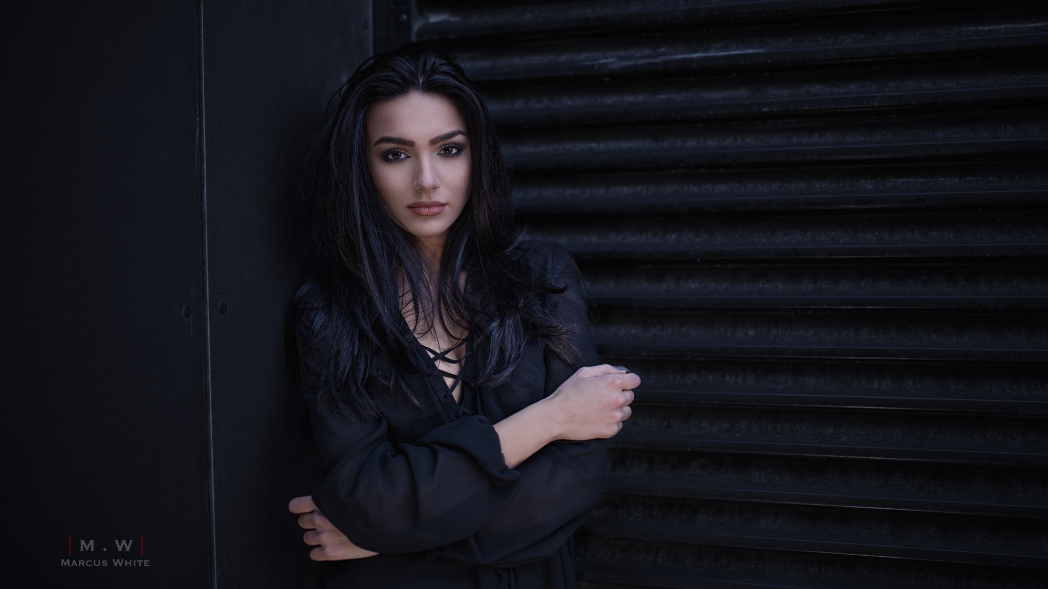 Woman with long dark hair in black dress HD Wallpaper