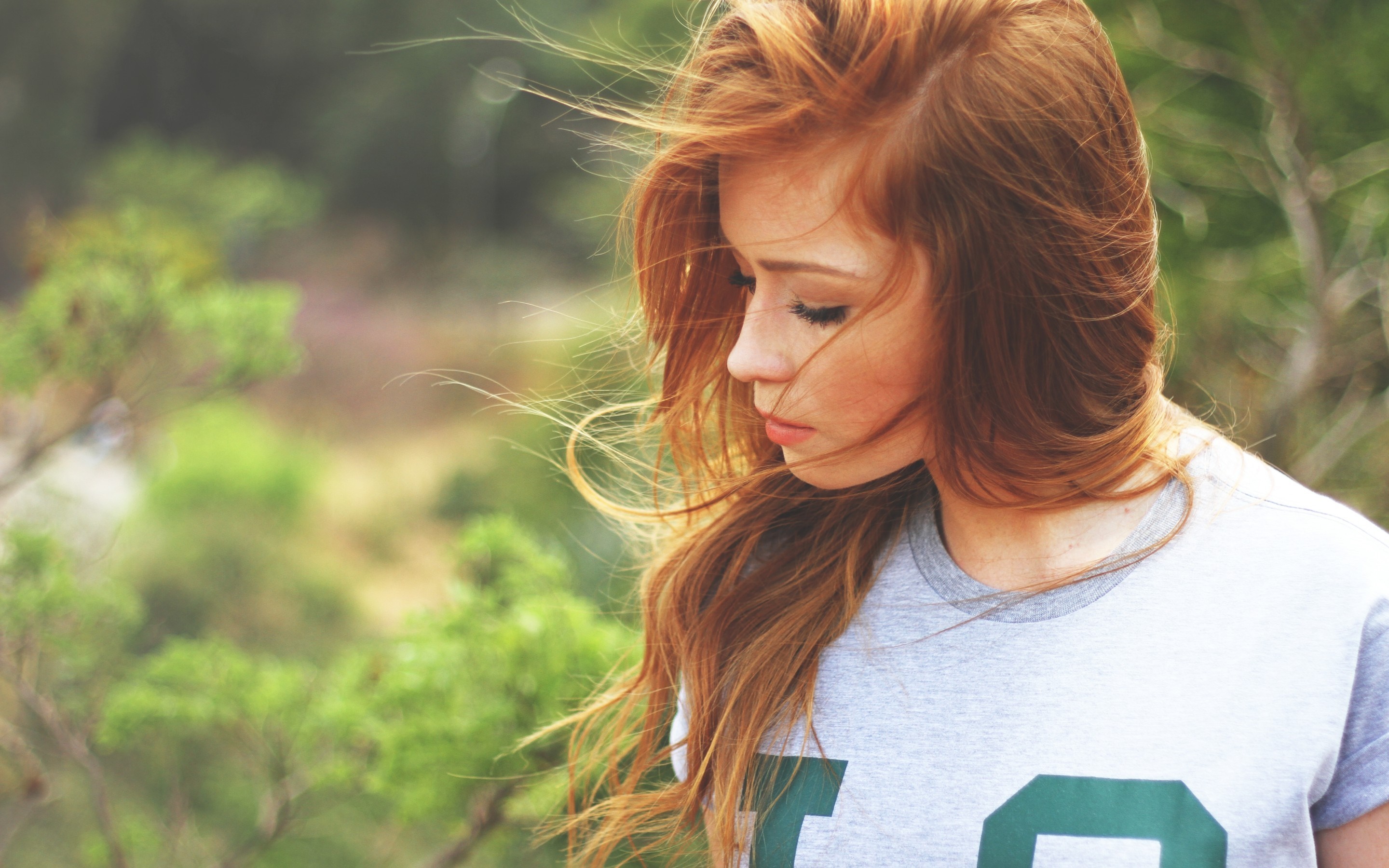 Redhead woman with closed eyes in a t-shirt HD Wallpaper