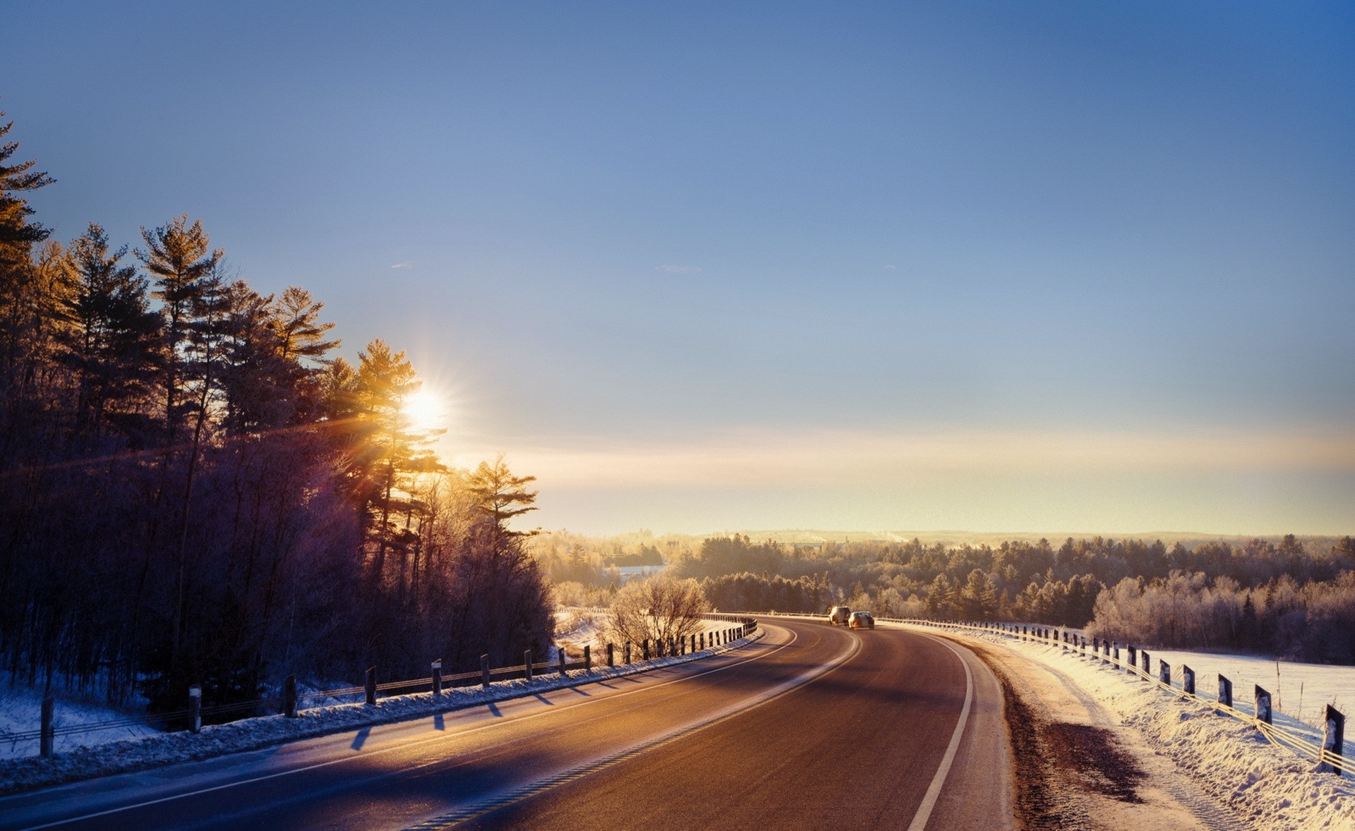 Winter road at sunrise with sun flare HD Wallpaper