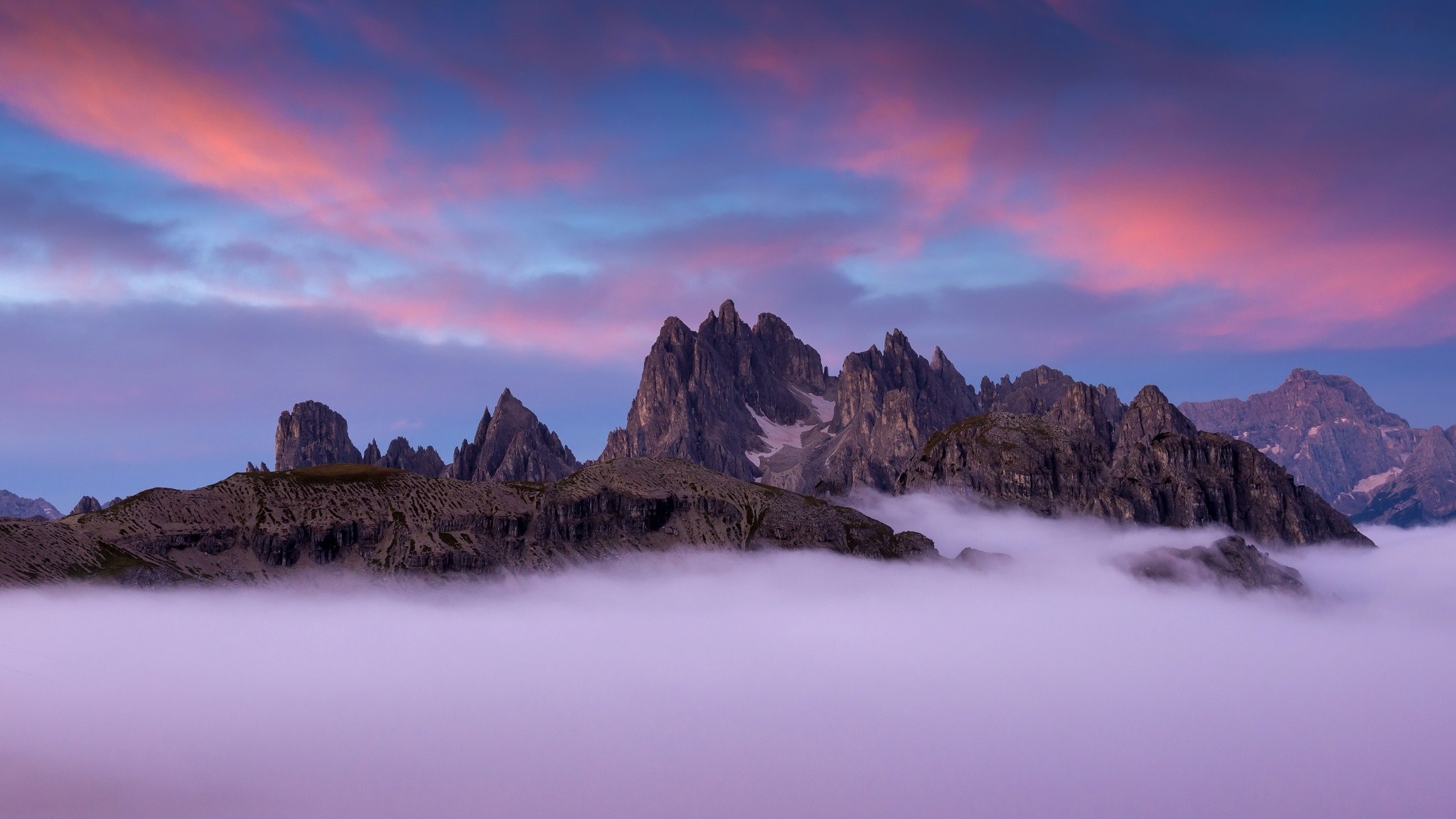 Mountain range above clouds at sunset HD Wallpaper