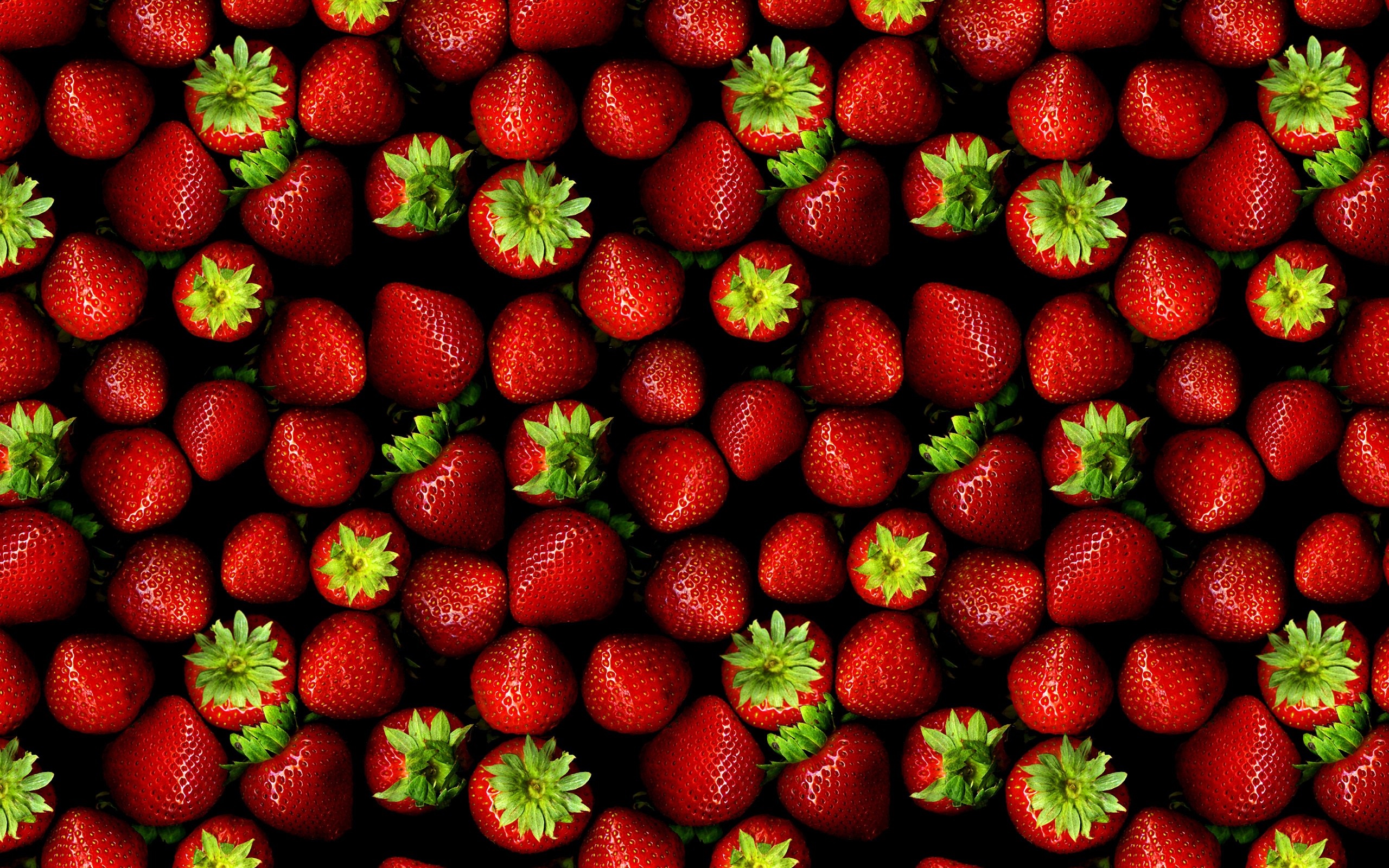 A pattern of fresh red strawberries with green leaves HD Wallpaper
