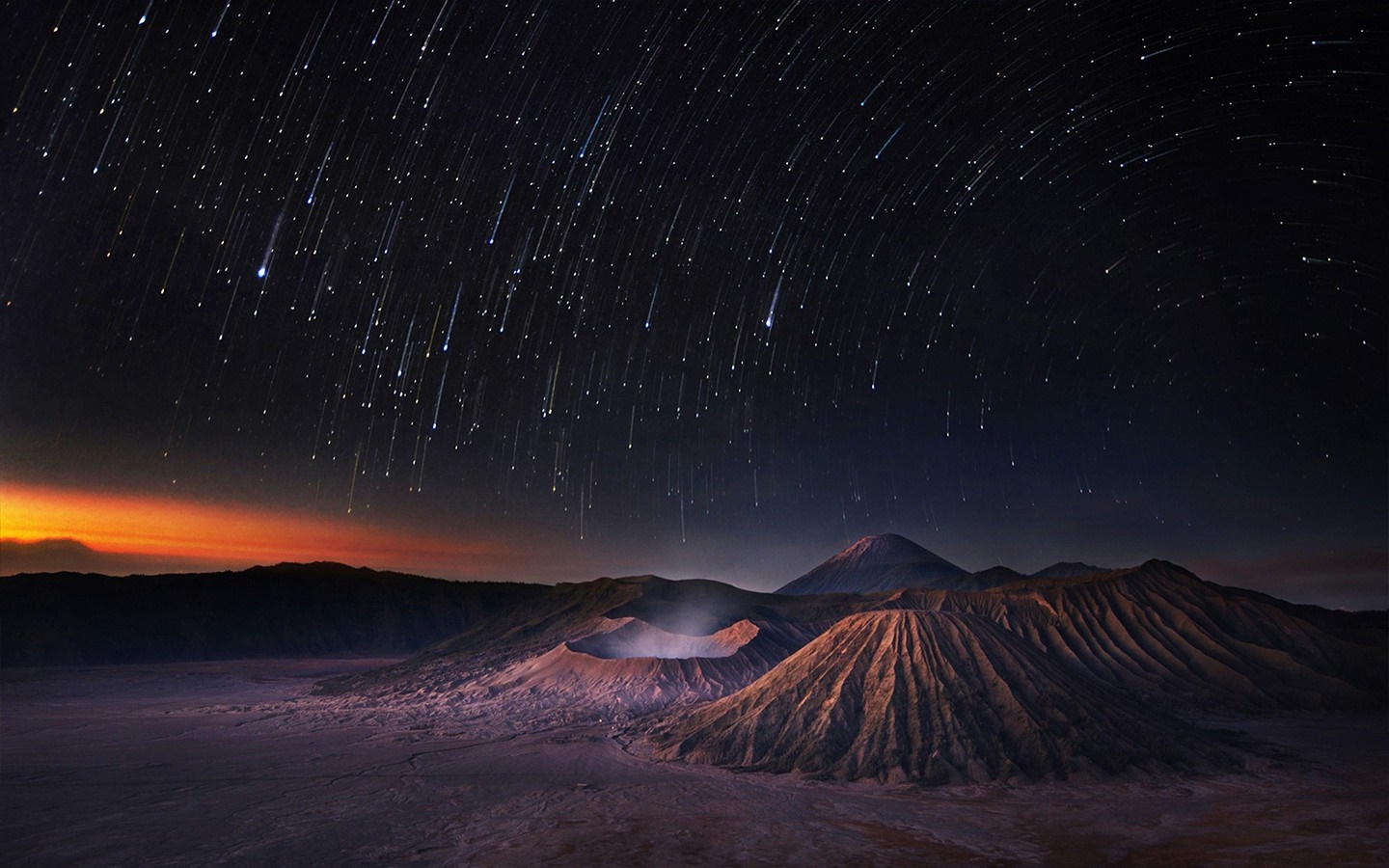 Mount Bromo volcano landscape with meteor shower at dawn HD Wallpaper