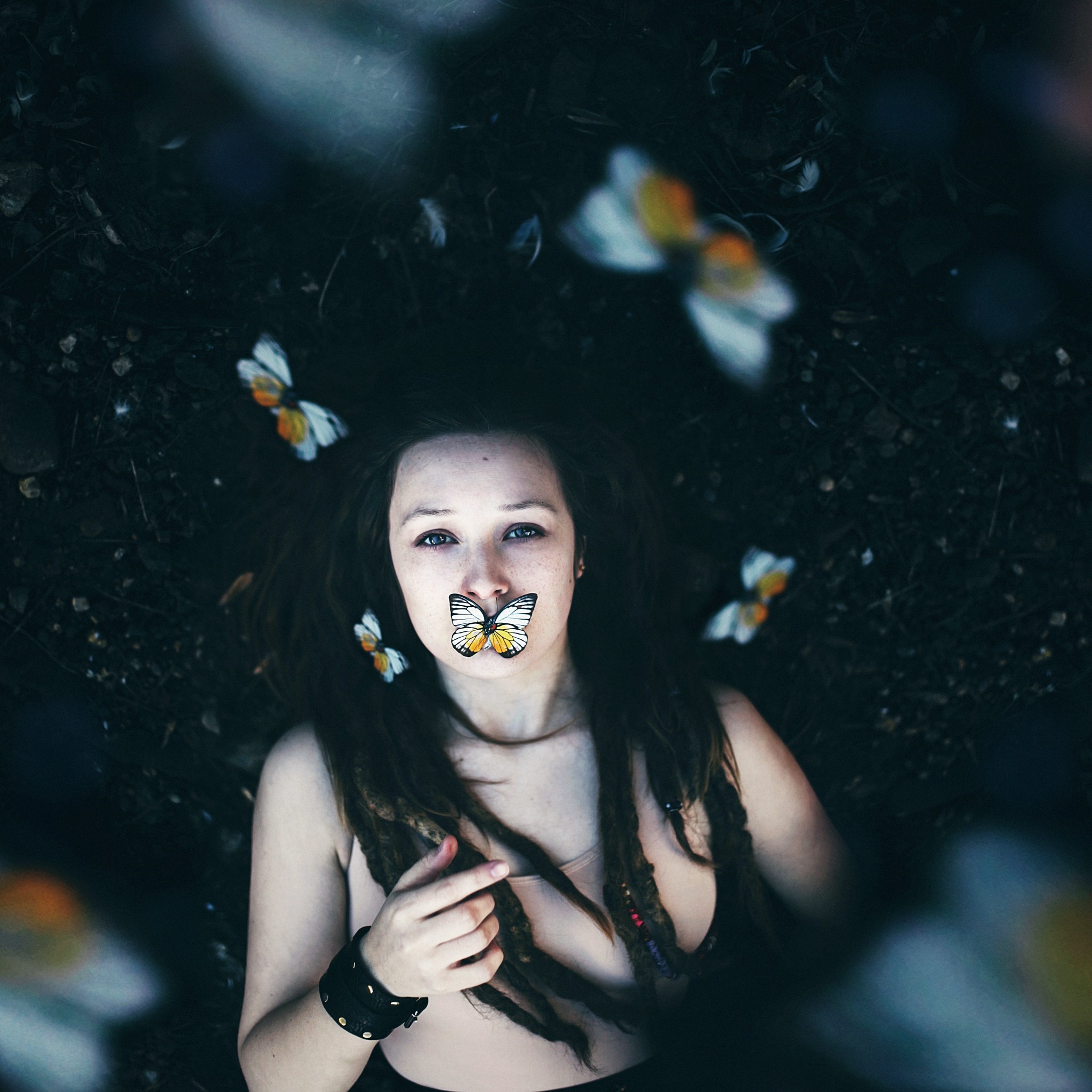 Woman with butterflies on her face HD Wallpaper