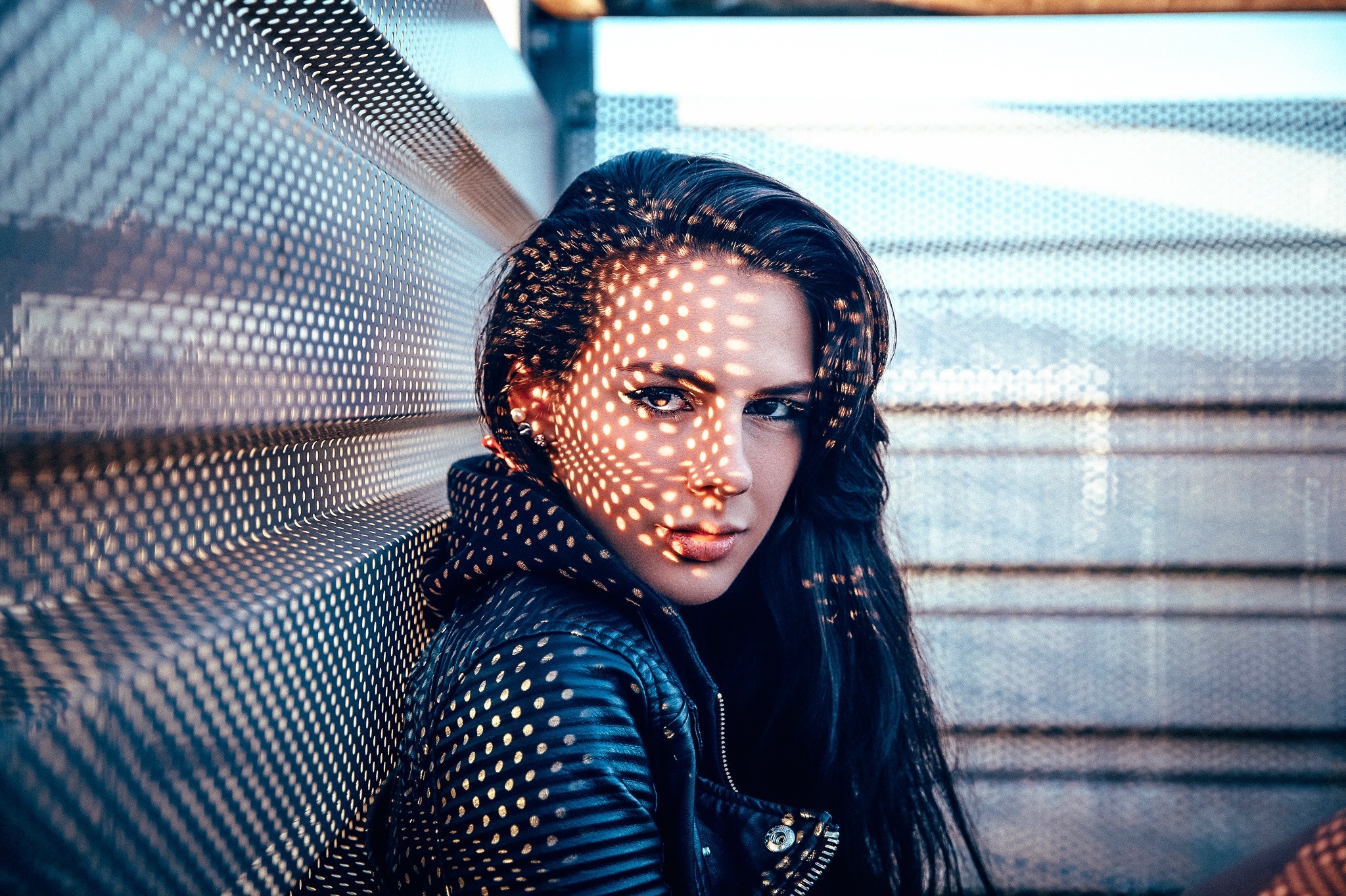 Woman with patterned light on her face HD Wallpaper