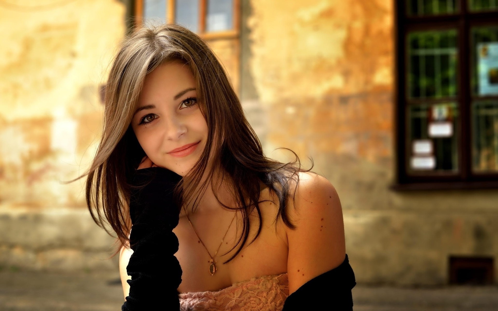 Young woman with brown hair and black gloves HD Wallpaper