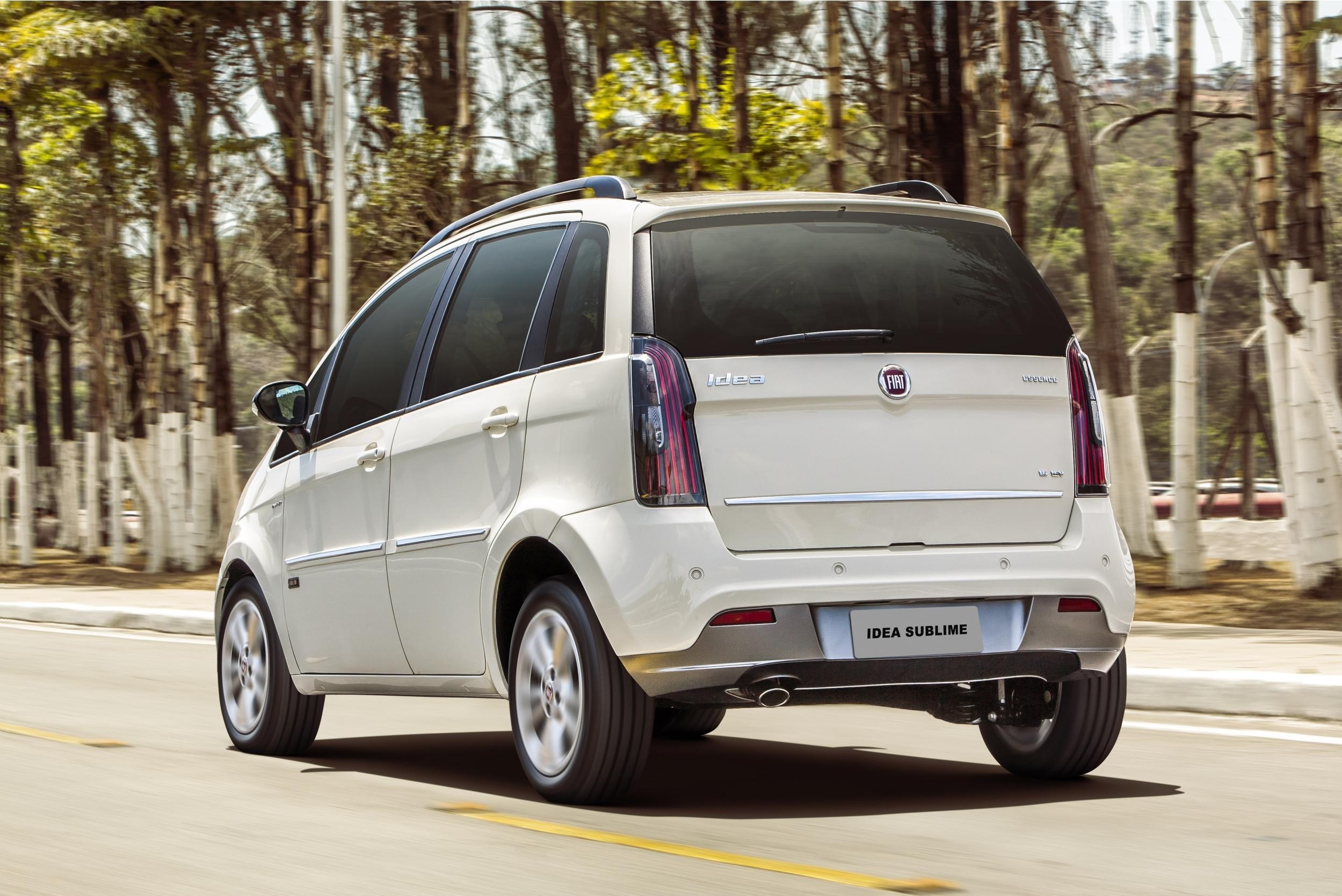 White Fiat Idea Sublime driving on a road HD Wallpaper