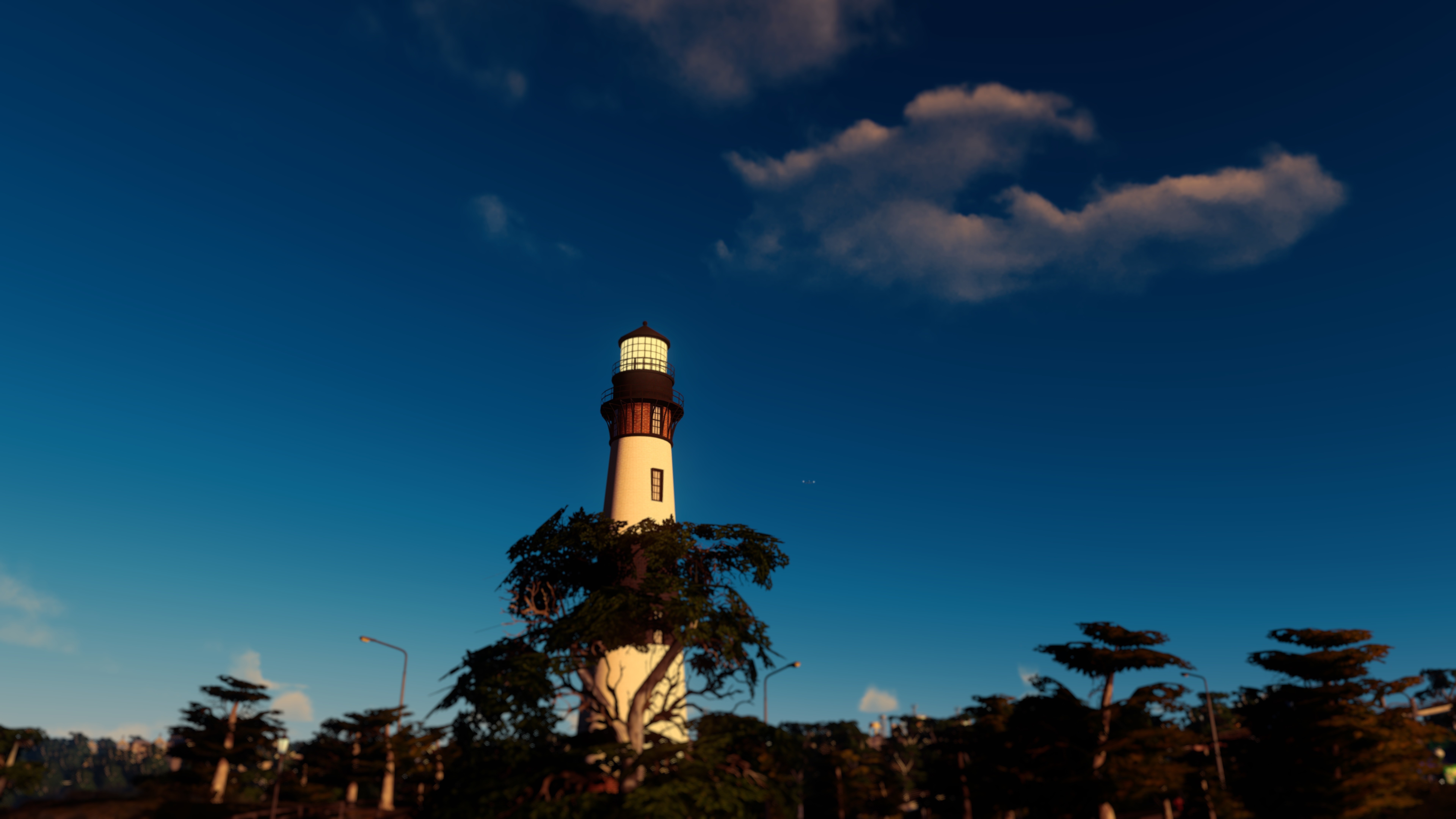 Lighthouse on a hill with trees and clouds HD Wallpaper