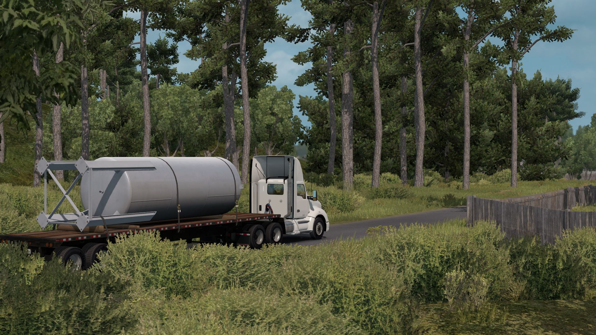 Truck carrying a large cylindrical tank on a flatbed trailer HD Wallpaper