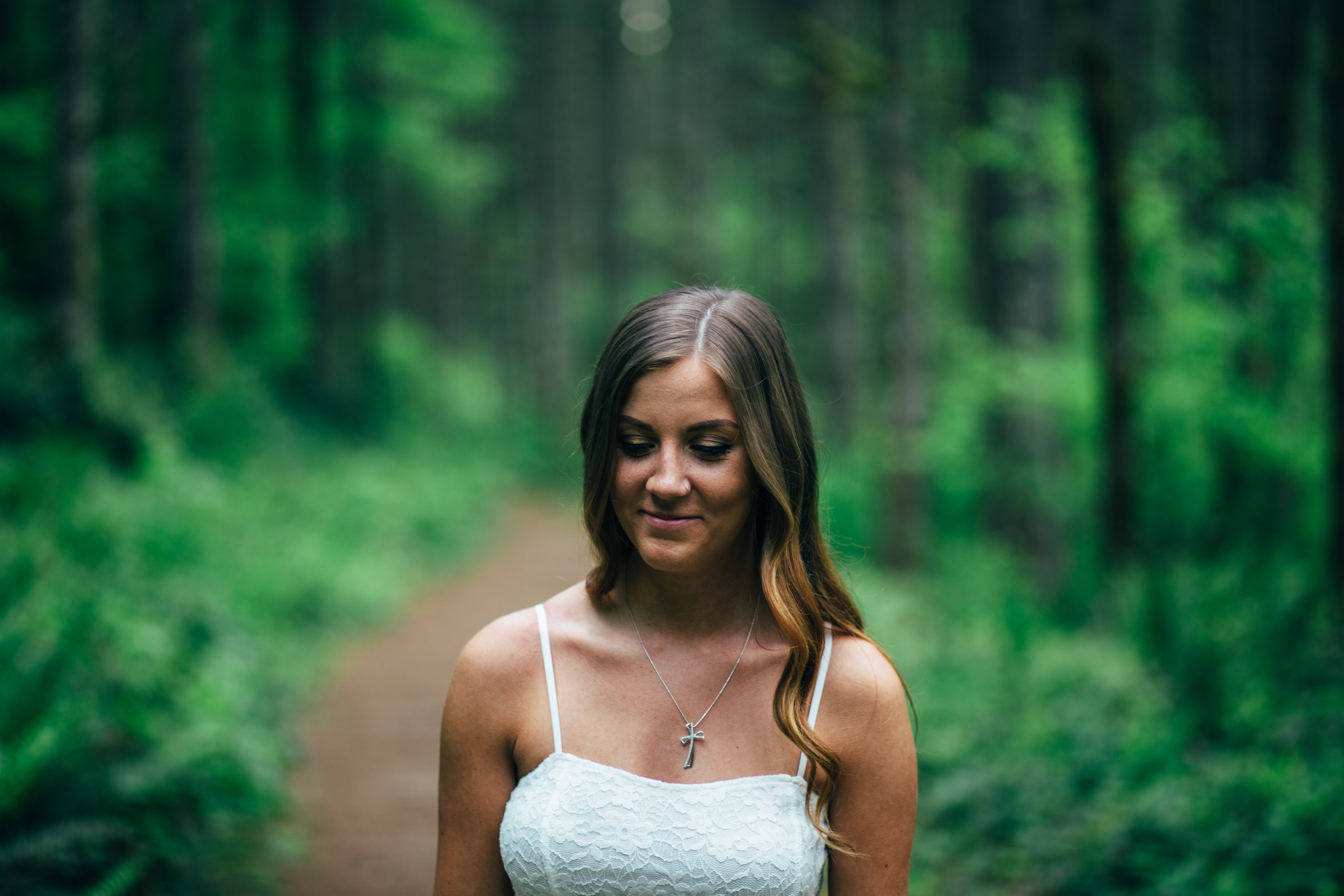 Woman in white dress in a forest HD Wallpaper