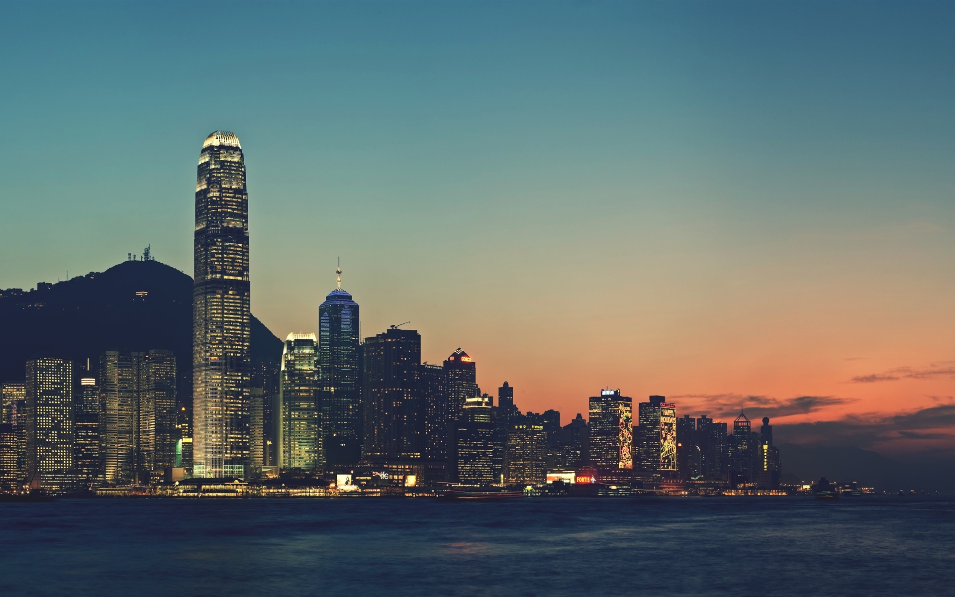 Hong Kong skyline at dusk with Victoria Harbour HD Wallpaper