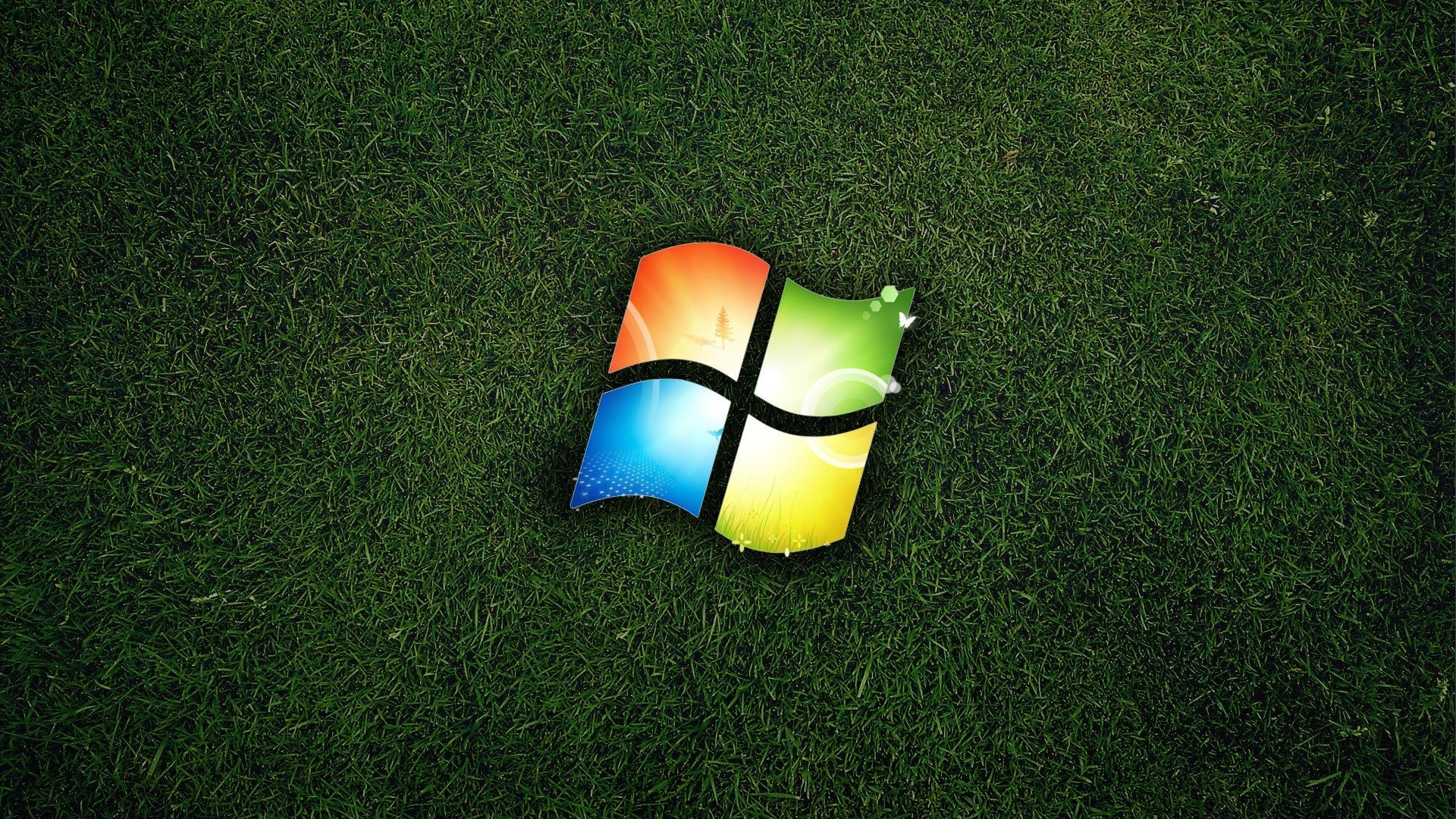 Microsoft Windows logo on green grass HD Wallpaper