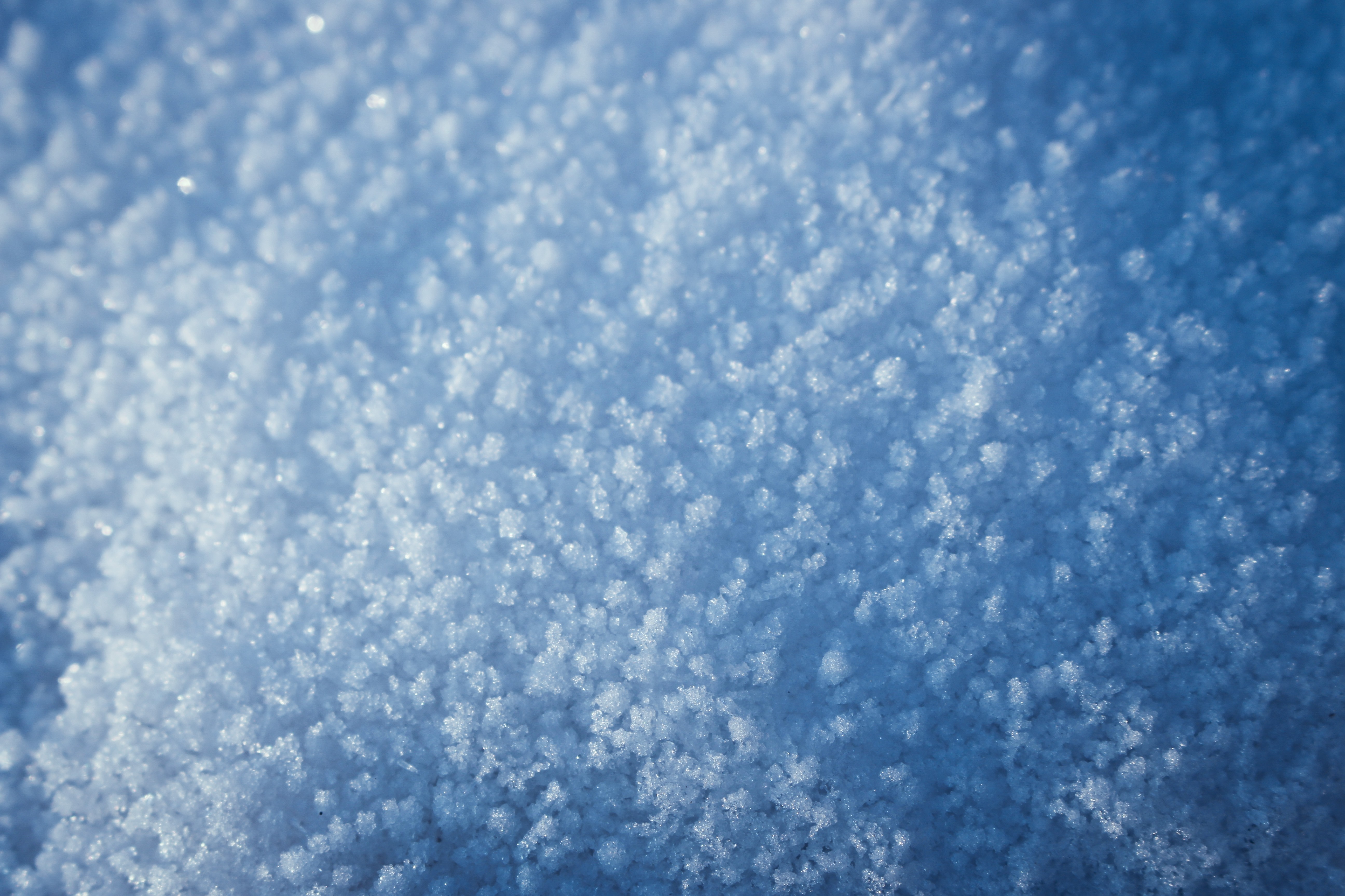 Close-up of snow crystals in sunlight HD Wallpaper