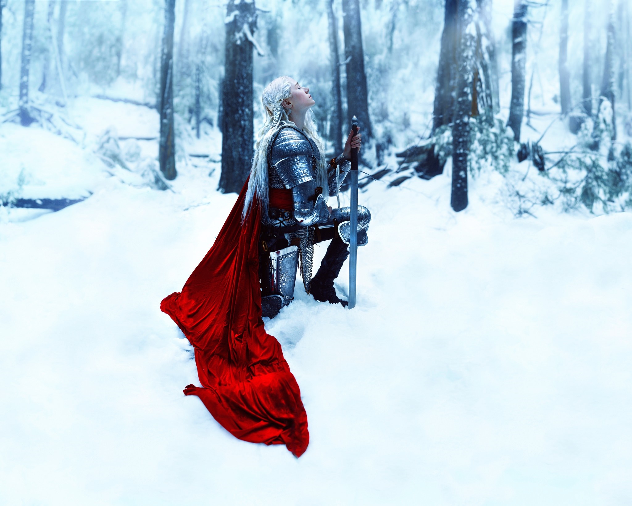 Woman in armor with red cape in snowy forest HD Wallpaper
