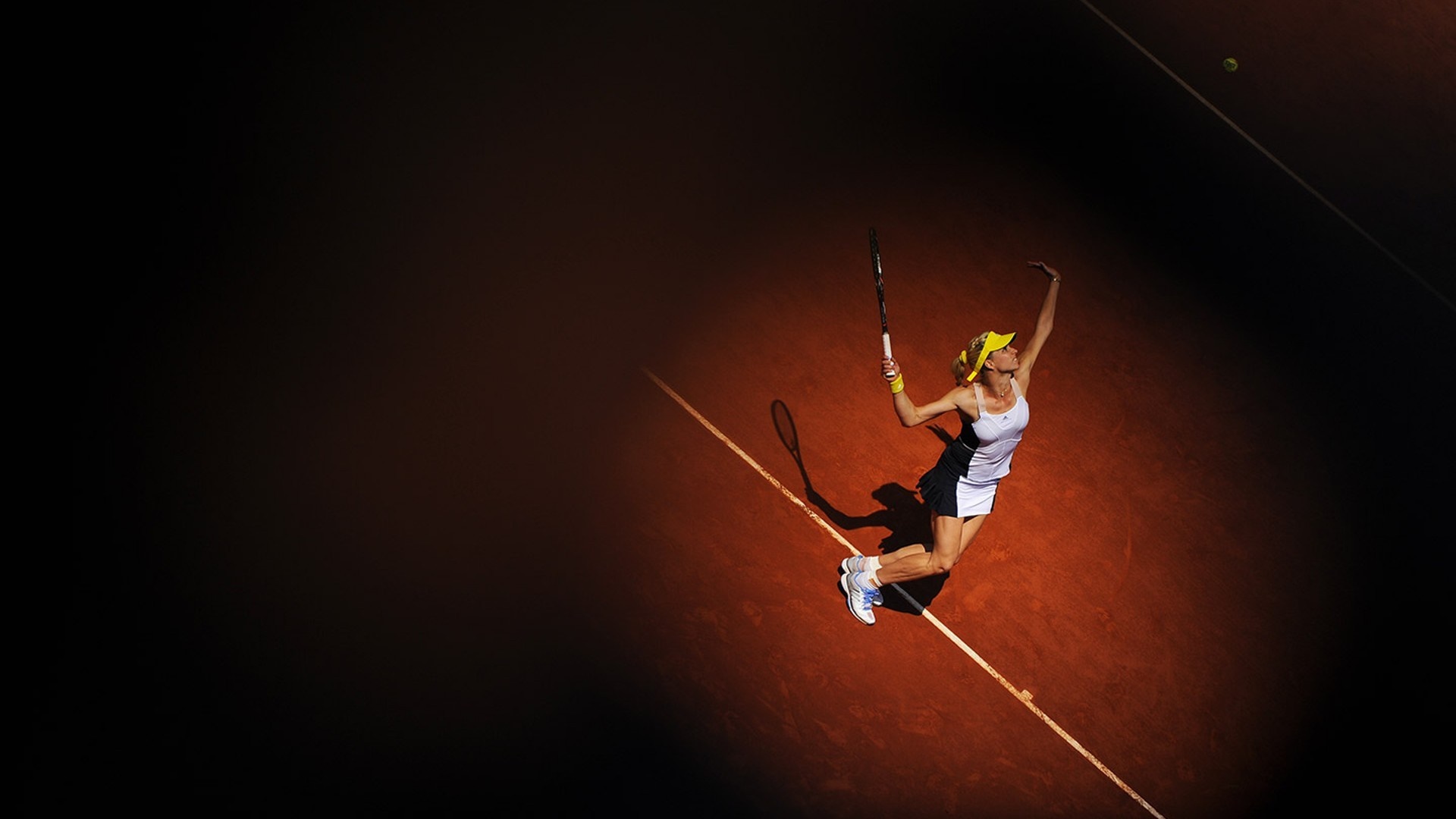 Maria Kirilenko serving on a clay tennis court HD Wallpaper