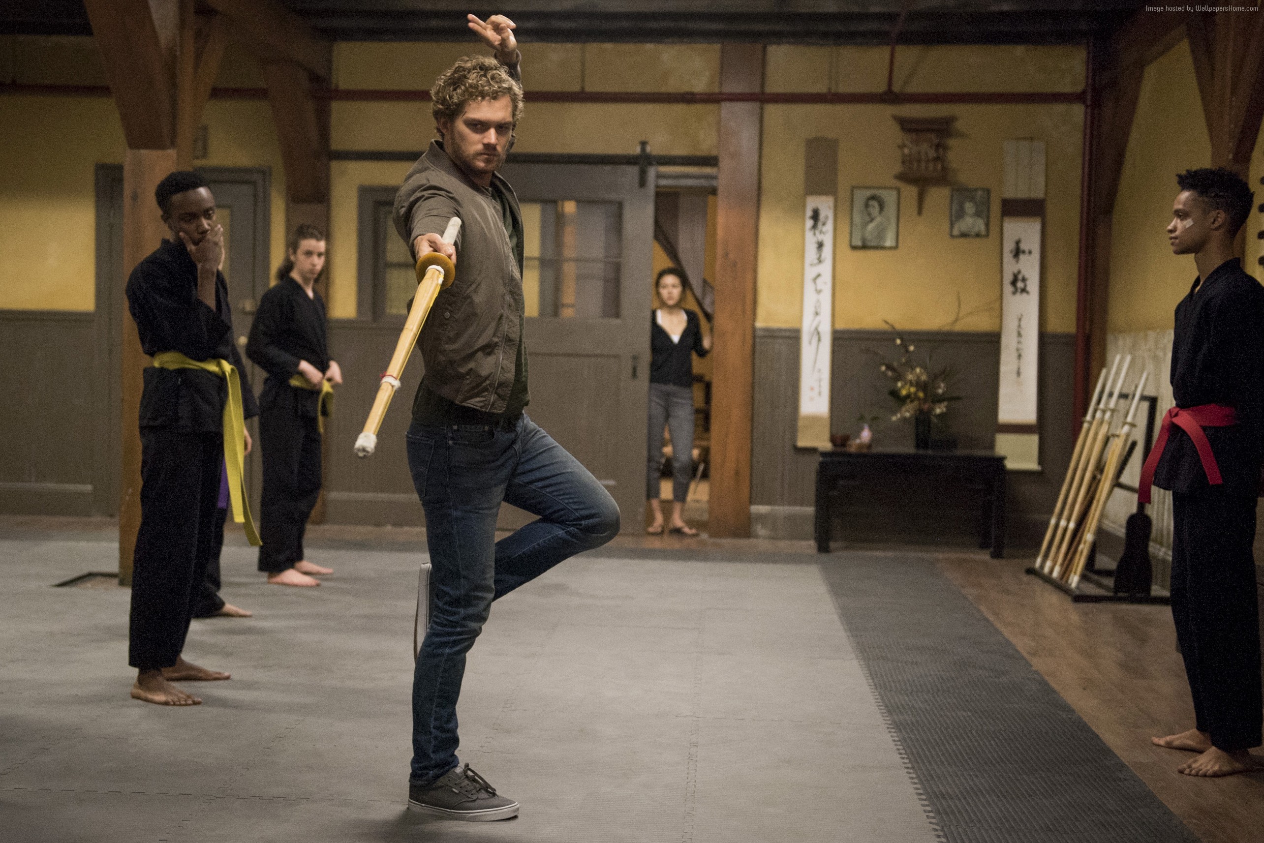 Iron Fist training with students in a dojo HD Wallpaper