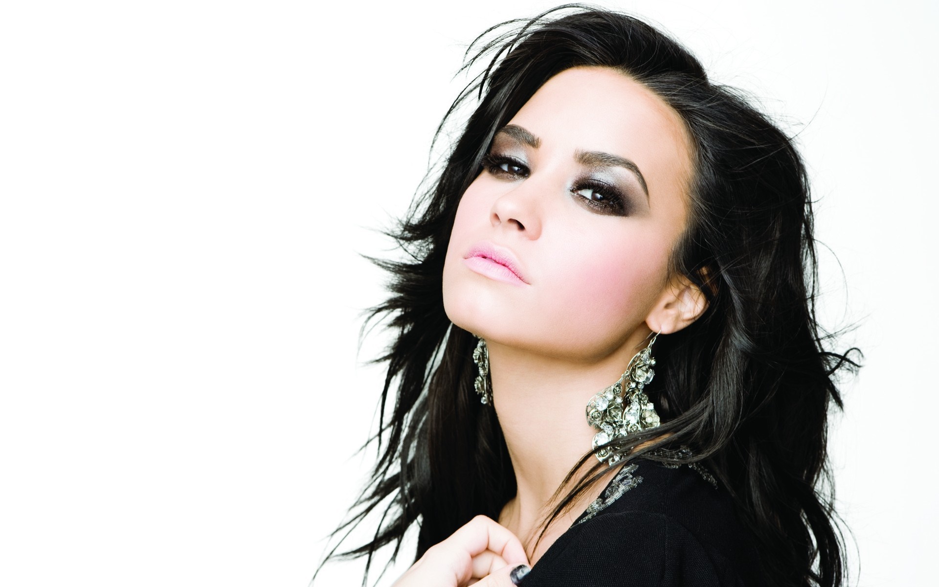 Demi Lovato portrait with dramatic makeup and earrings HD Wallpaper