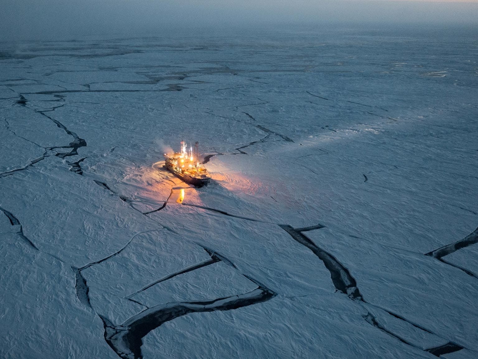 Ship navigating through cracked ice in the Arctic HD Wallpaper