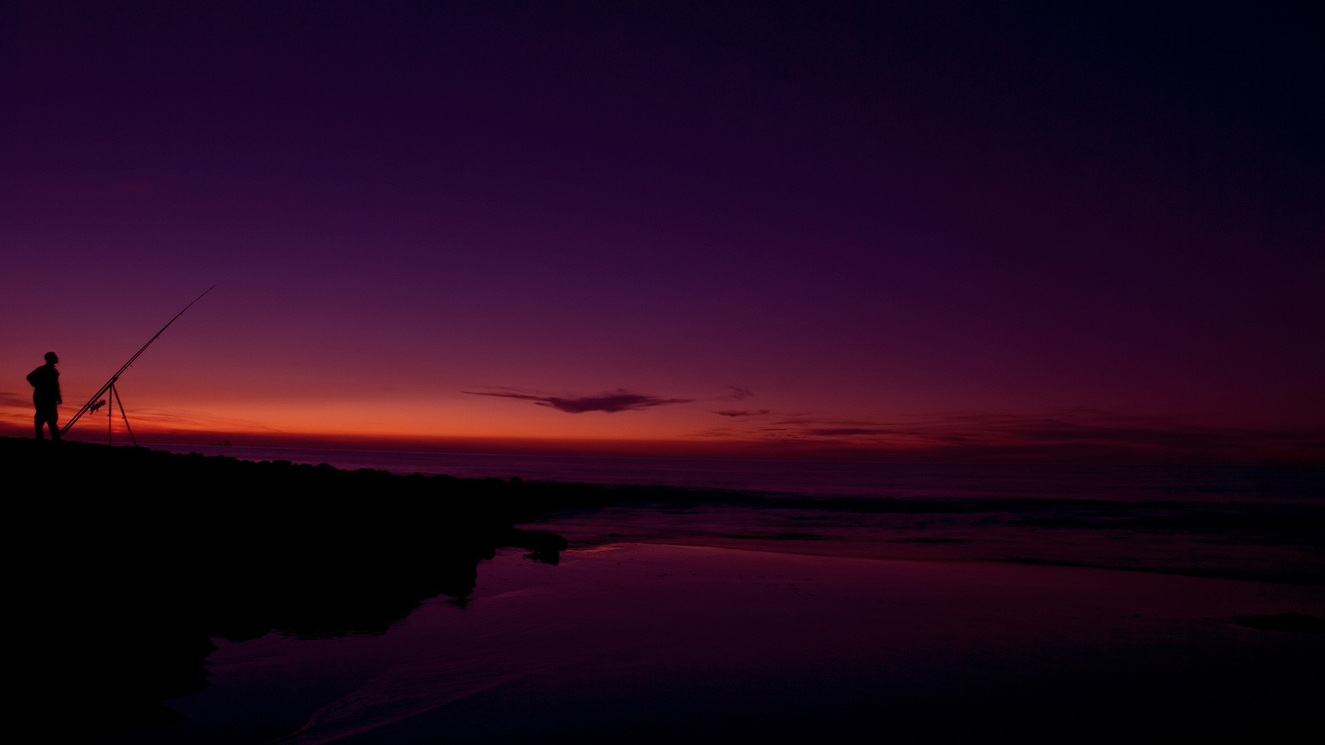 Fisherman with rod at sunset on the coast HD Wallpaper