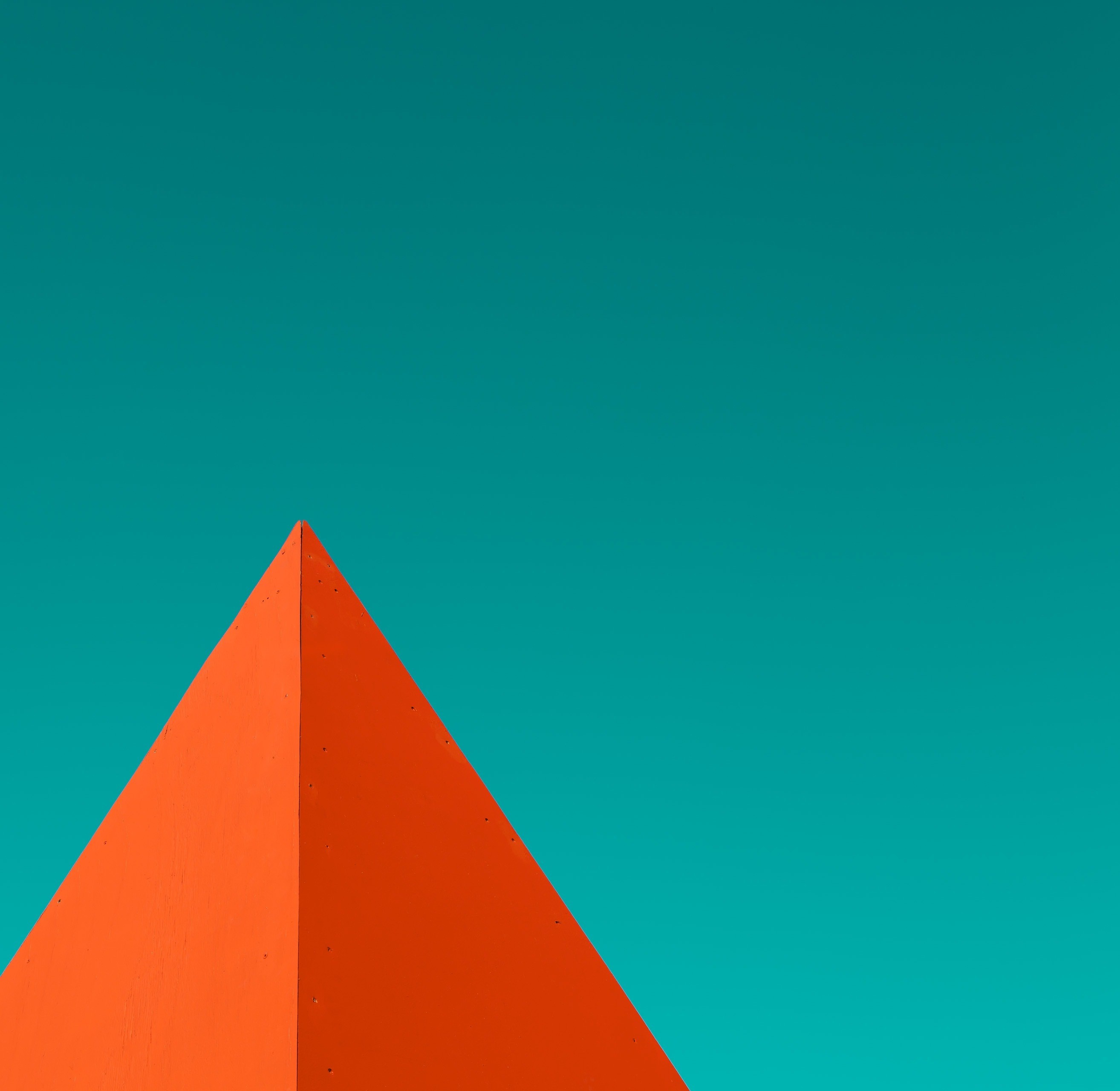 Orange pyramid against a teal sky HD Wallpaper