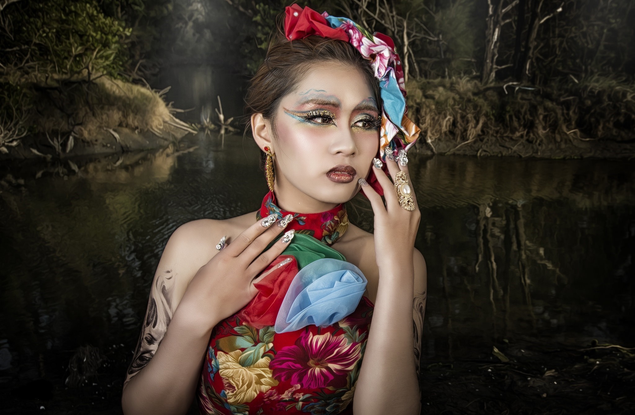 Woman with elaborate makeup and floral dress in a forest HD Wallpaper