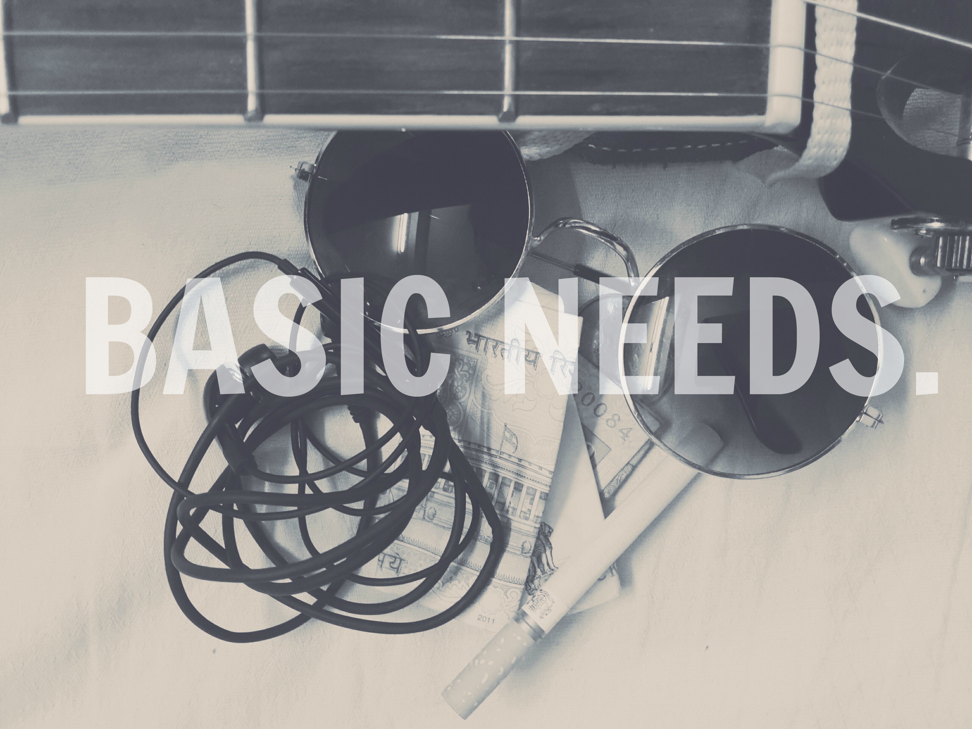 Basic Needs text over guitar, sunglasses, money, and cigarette HD Wallpaper